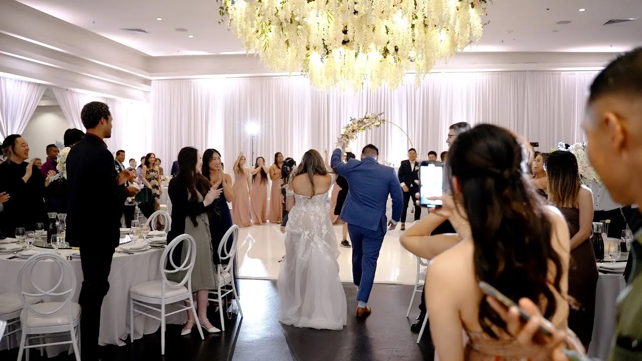 Video still of the grand entrance into the Venue by Three Petals ballroom