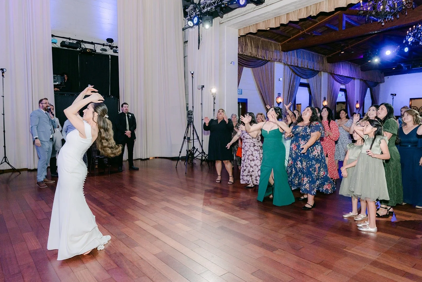 Mariana in the middle of the dance floor during a reception game