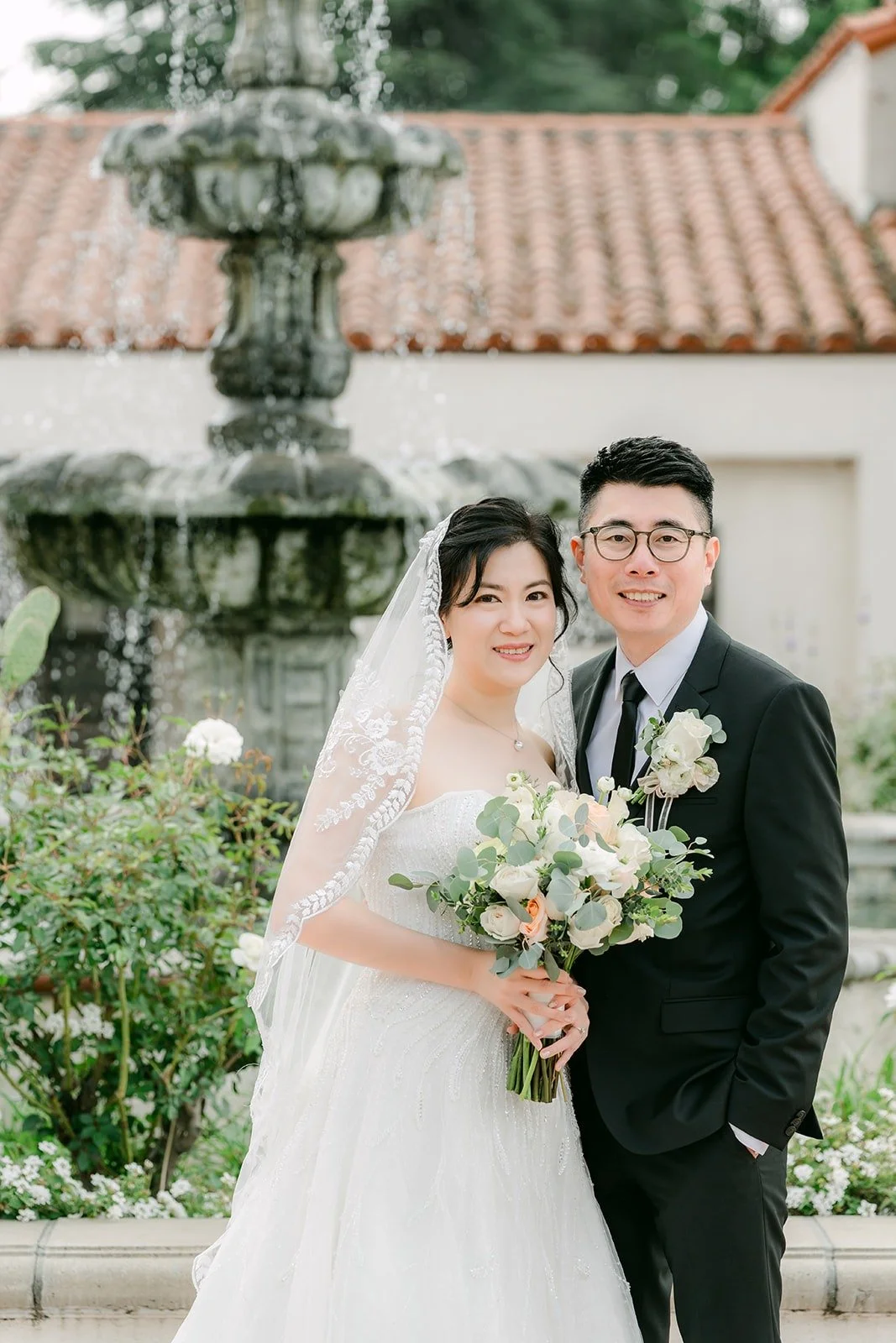 Eunice and Eric close together by the tiered fountain
