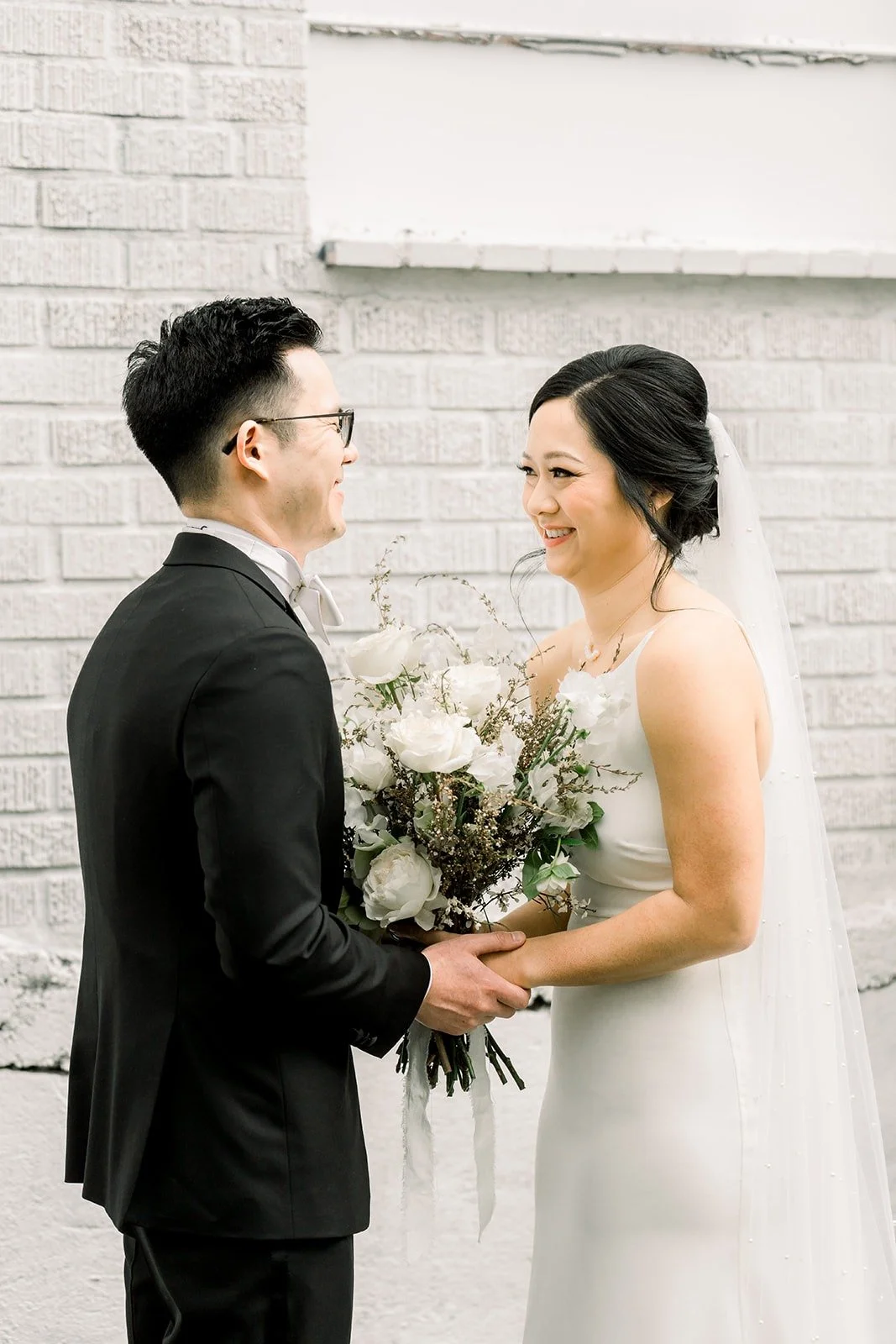 Alex holds Cindy's hands as they face each other