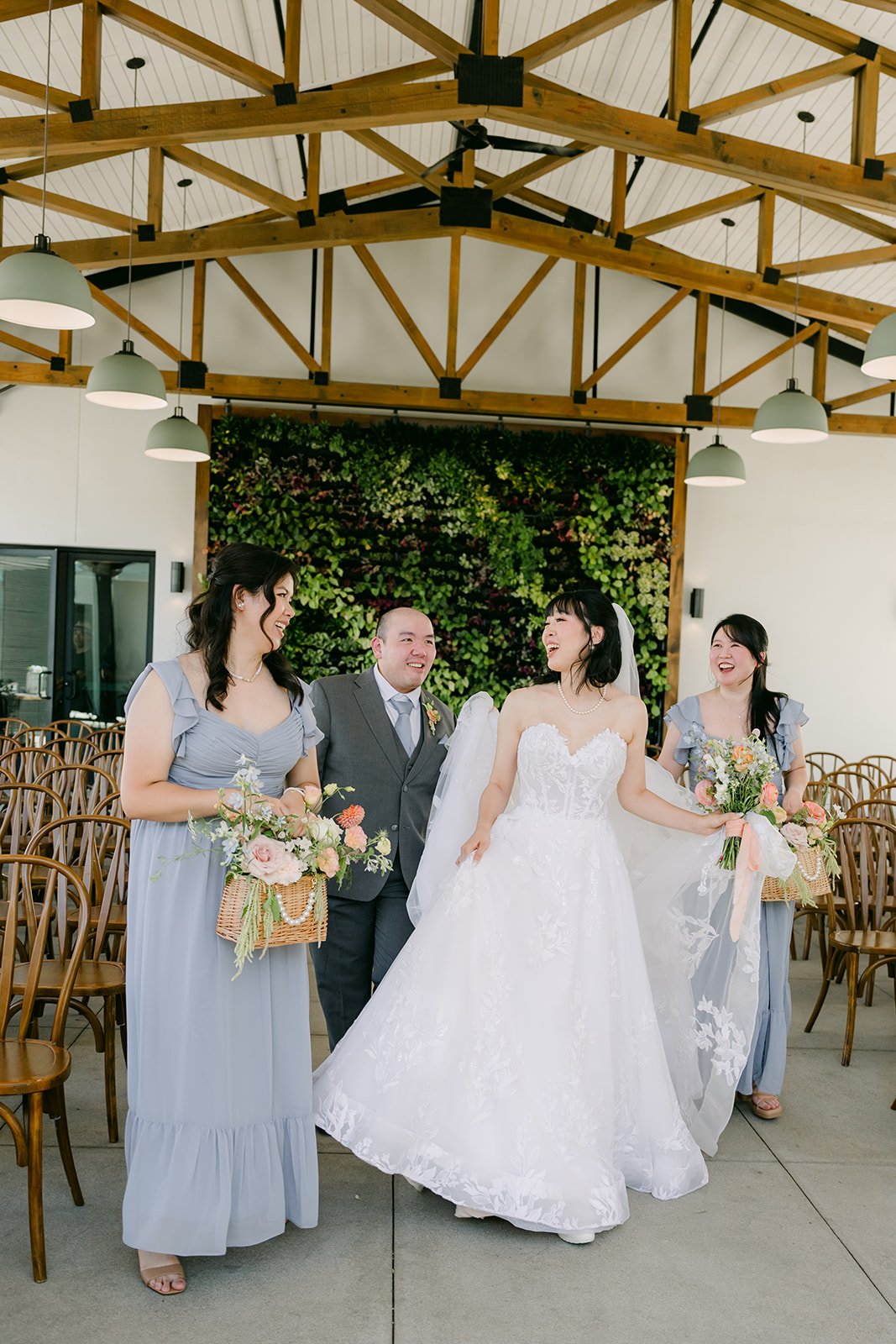 Wedding party walking under the Pavilion trusses