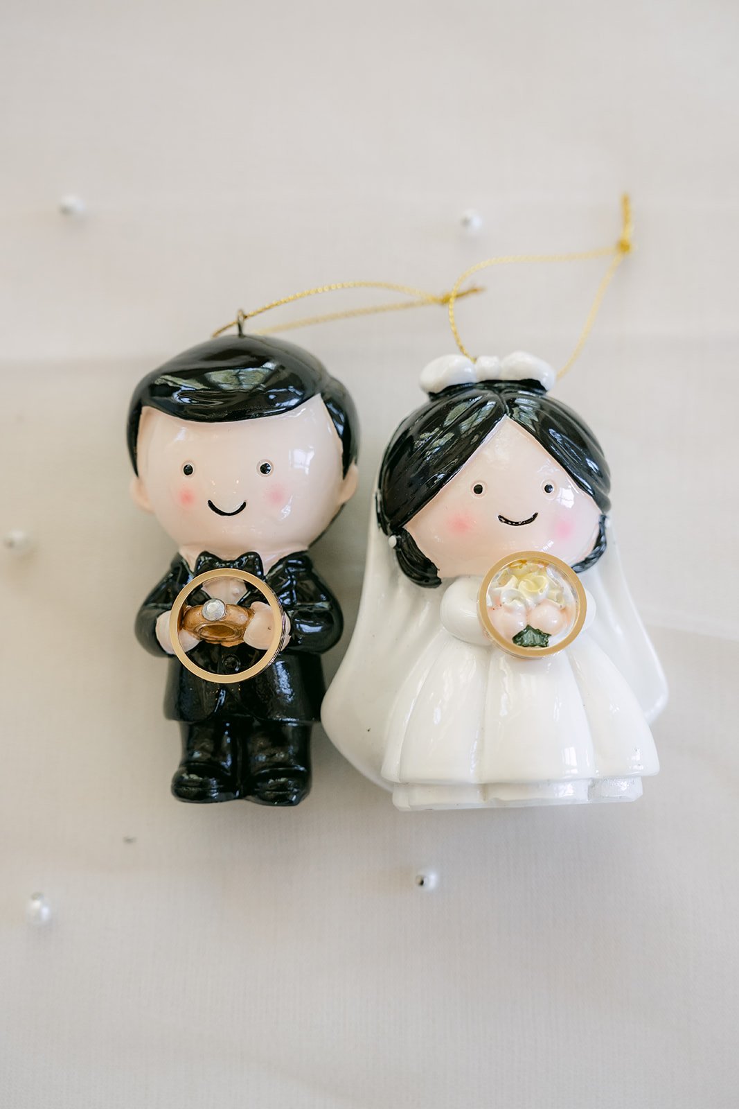Bride and groom figurines dressed for the wedding