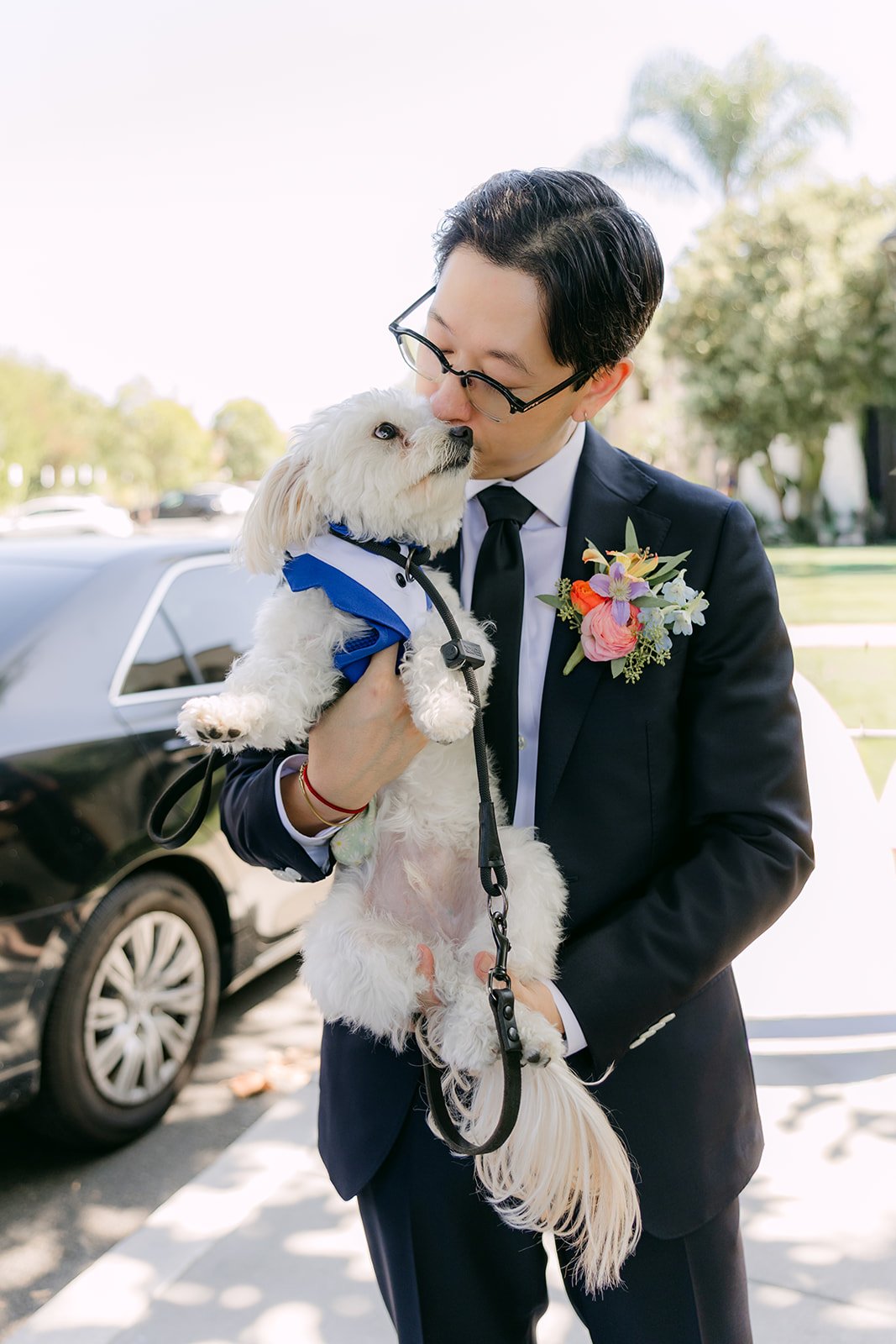 Leroy nuzzling the dog before heading to the venue