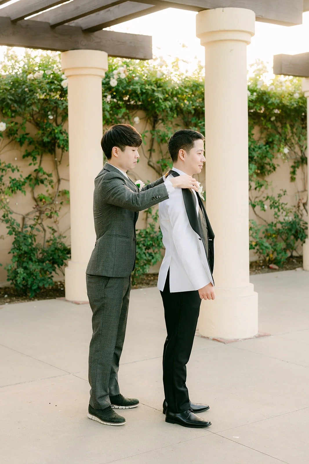 Eungdap helping Chungman with his boutonniere