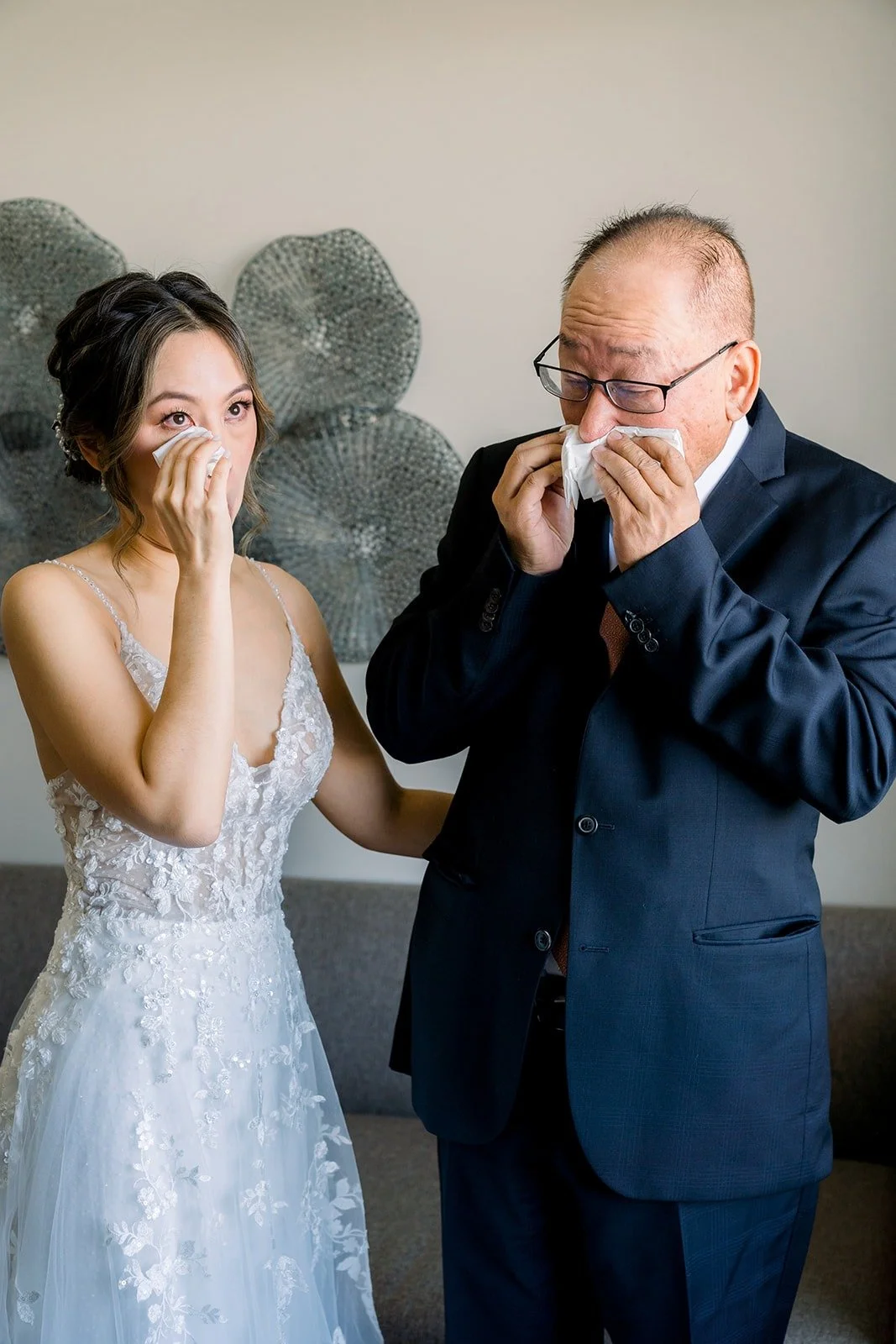 Josephine's dad wiping away tears as he sees her in her gown