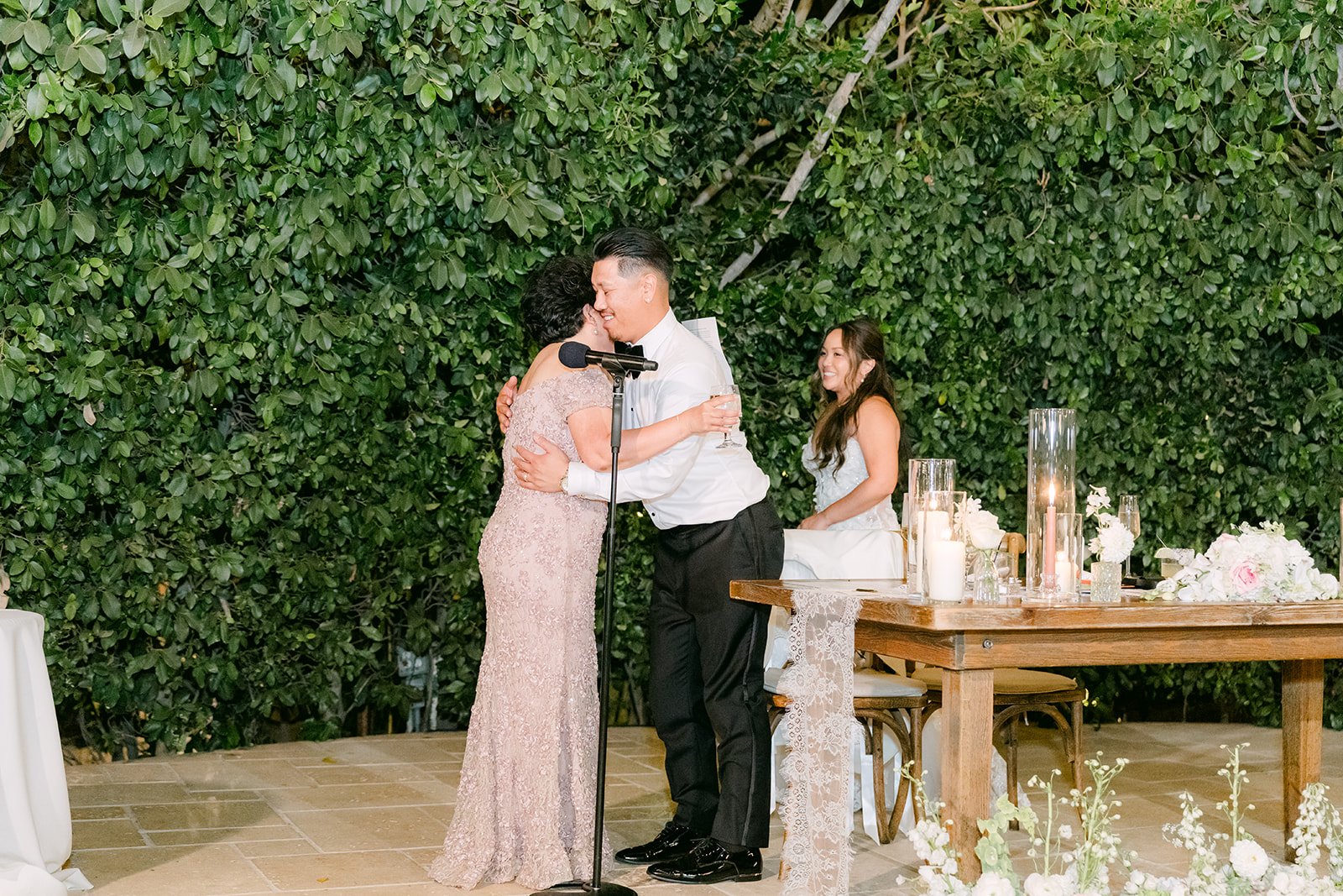 A heartfelt hug for Caryl after a toast.
