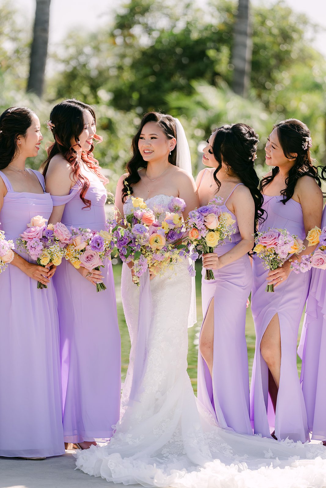 Vannie with her bridesmaids in lilac gowns.