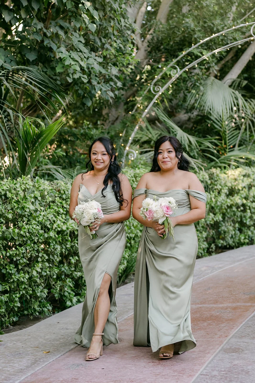 Maids of honor April and Kizzy walking down the aisle together.