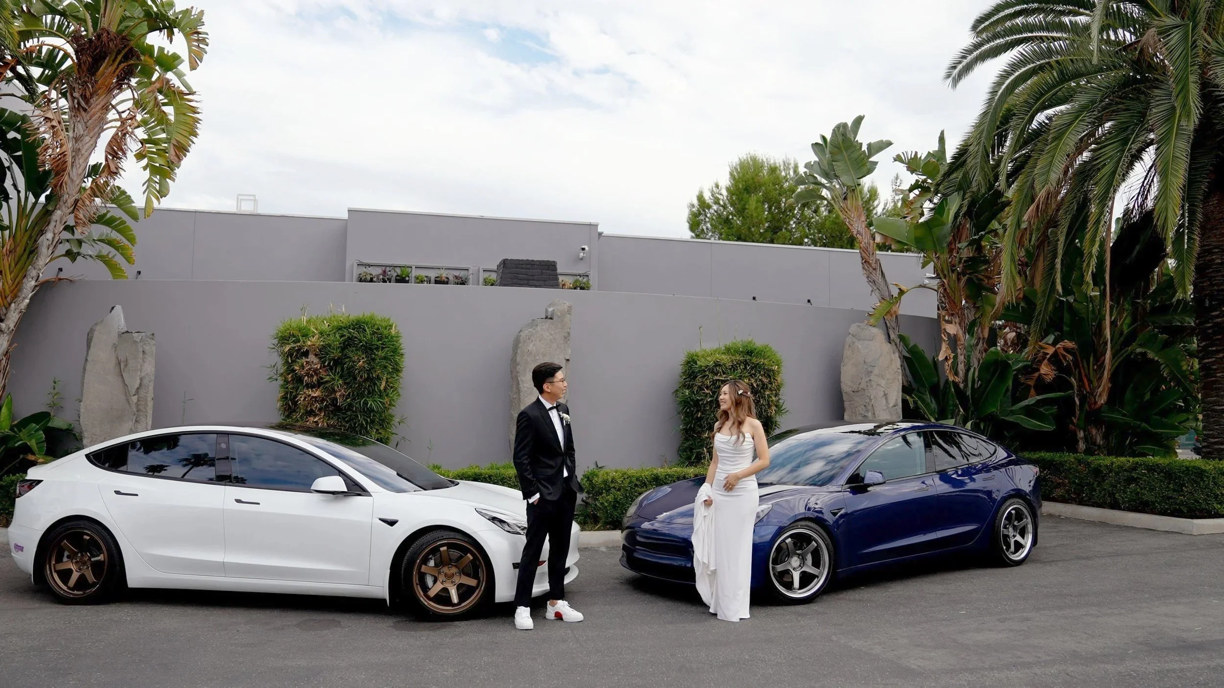 Ann and Anthony with their Teslas at The Colony House