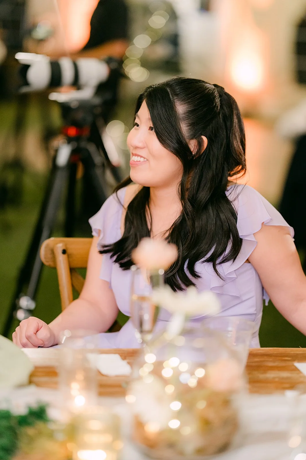 Bridesmaid laughing during the speeches
