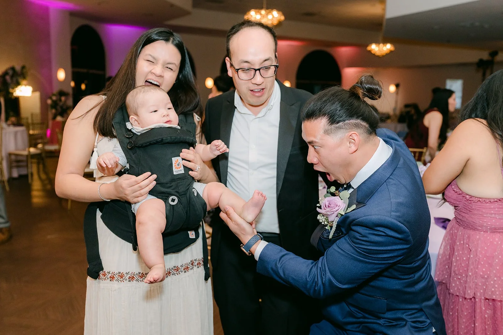 Guests dancing and laughing together.