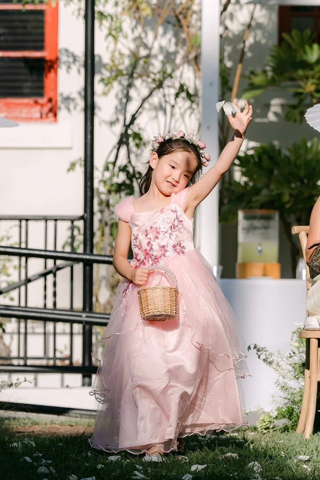 The flower girl tossing petals down the aisle