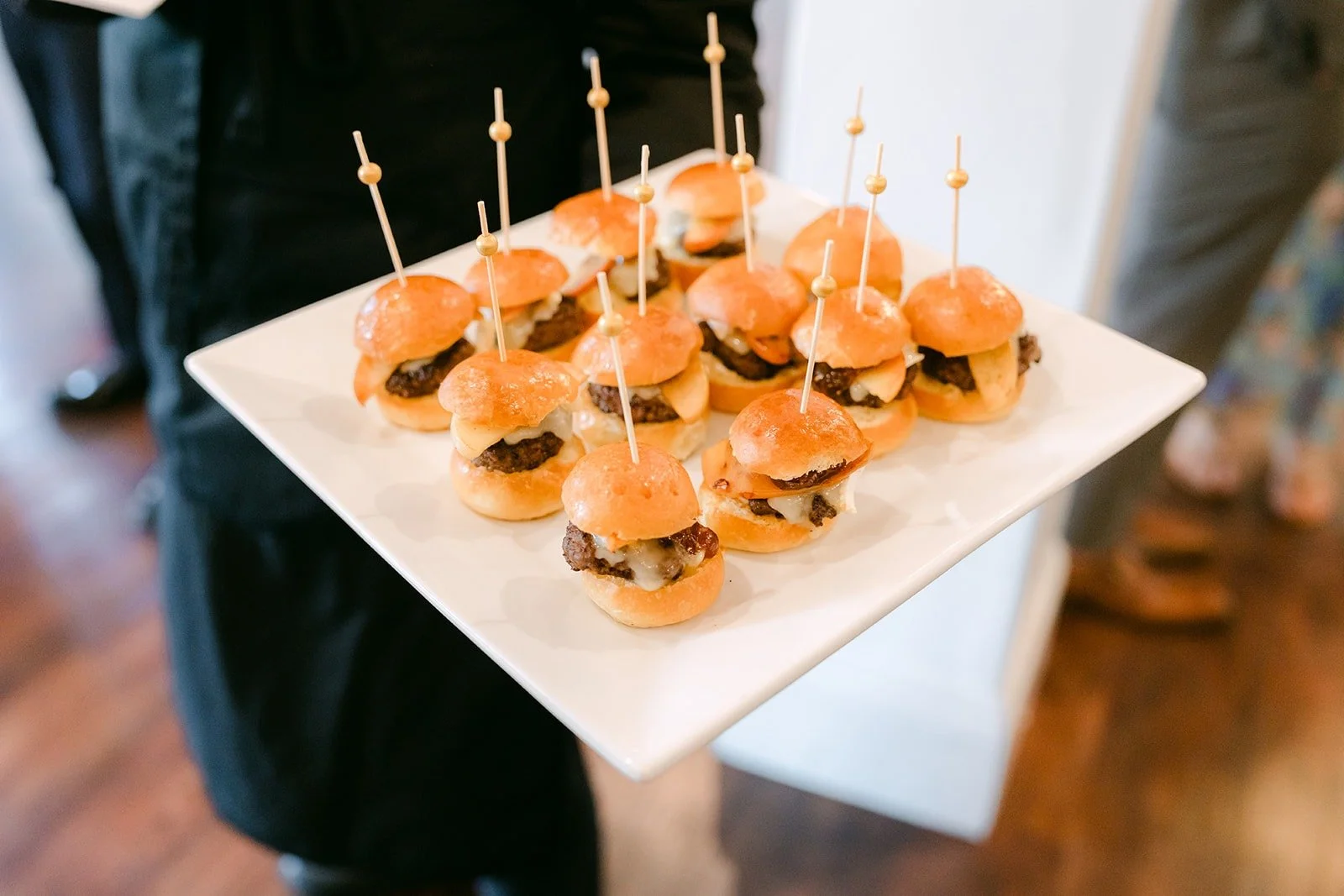 A tray of slider appetizers passed during the reception