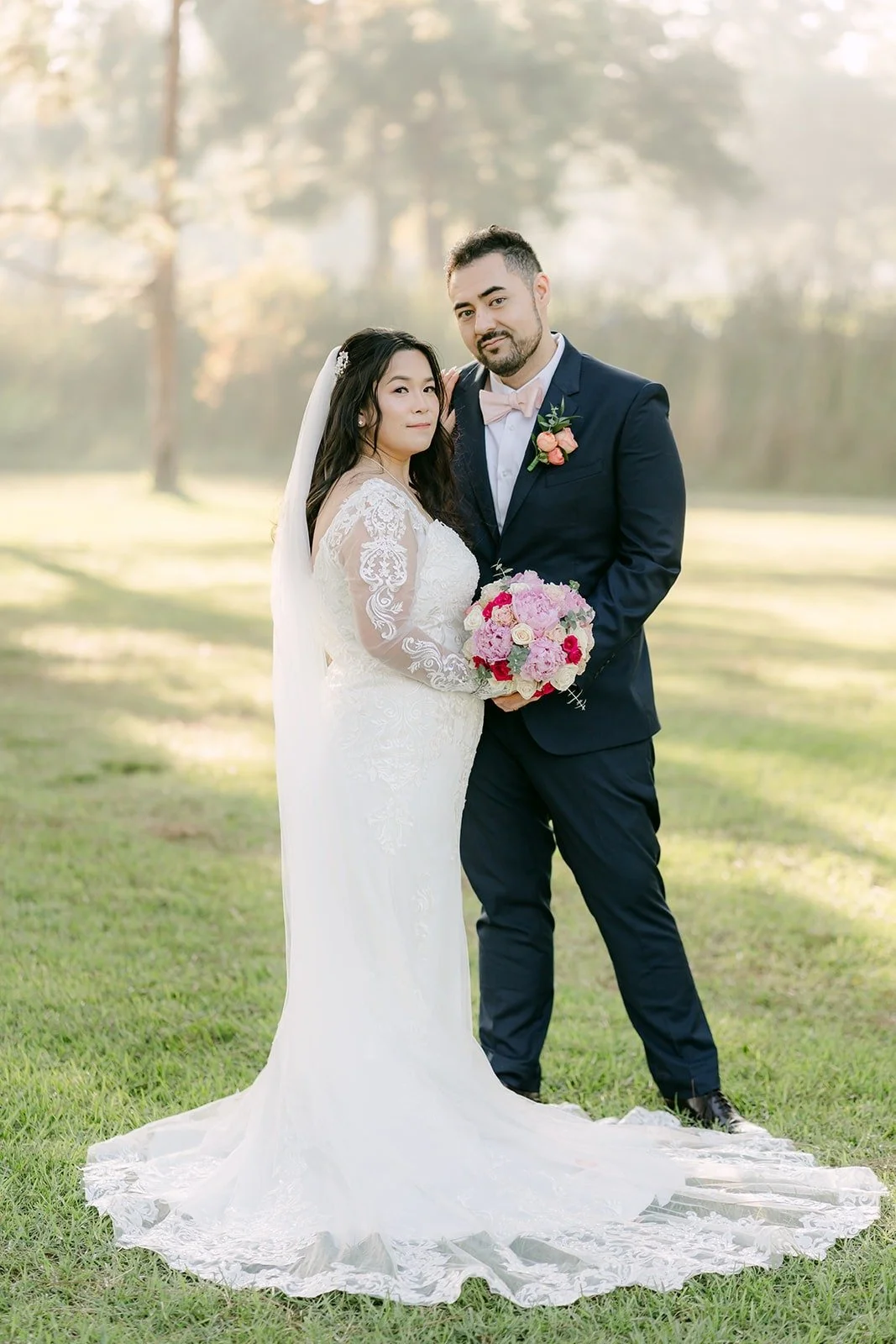 Amy and James standing together in the soft morning haze at El Dorado Nature Center