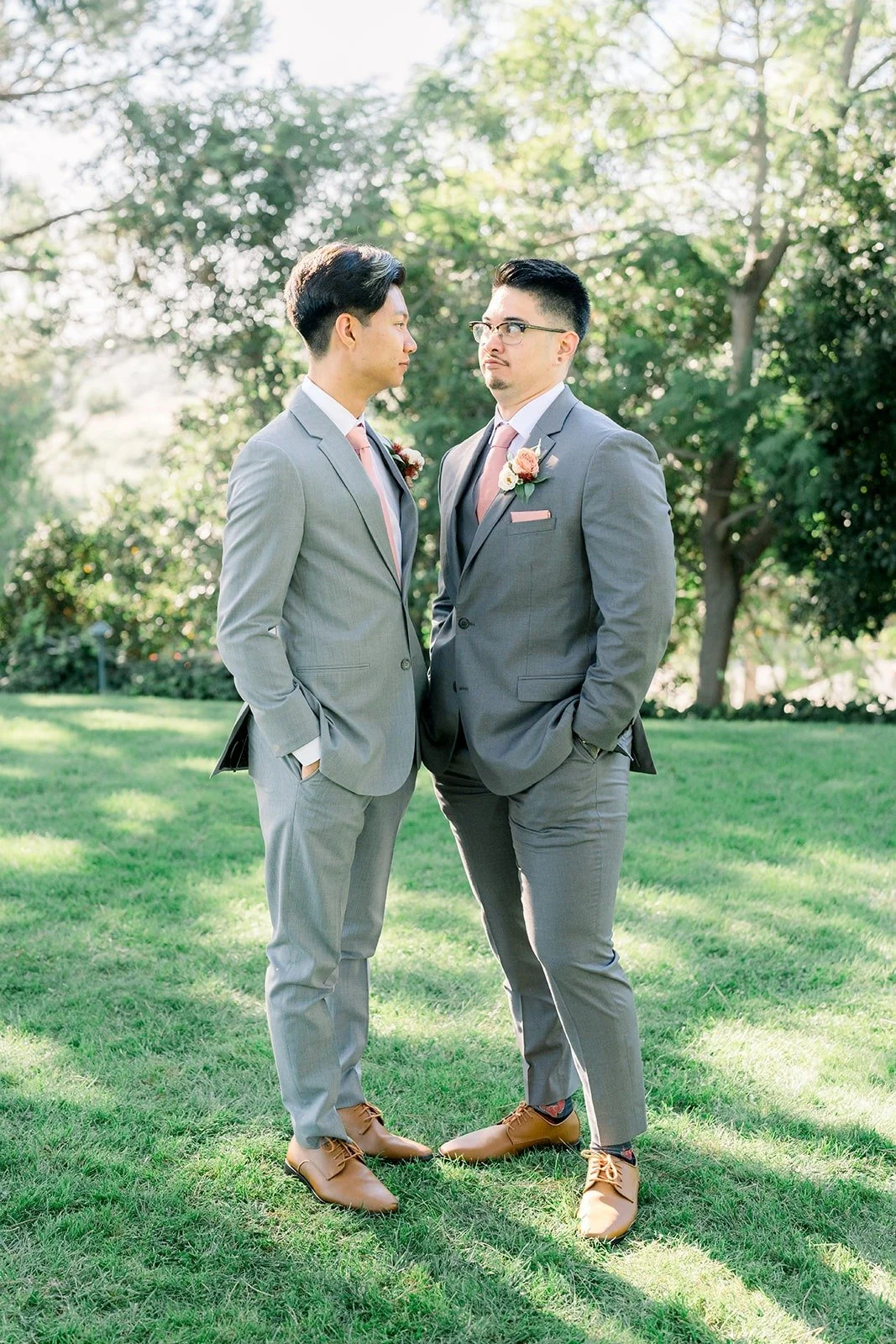 Mikey and a groomsman side by side on the lawn
