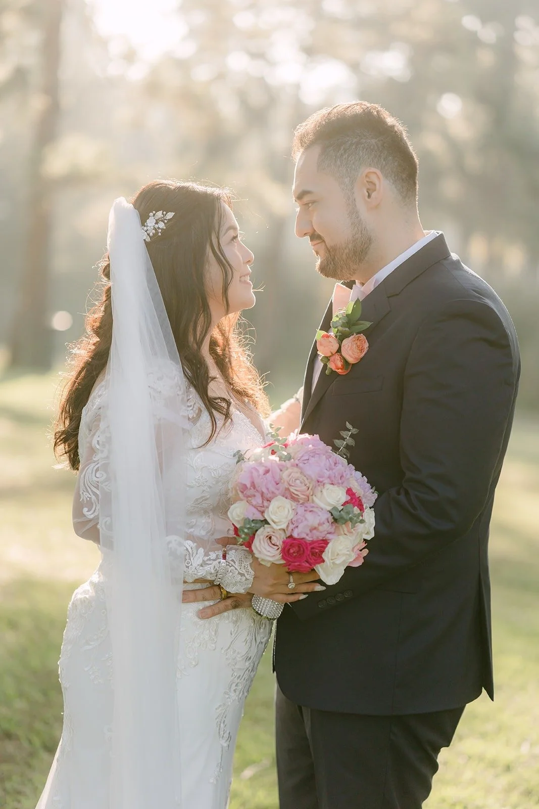 Amy and James forehead to forehead in warm backlight