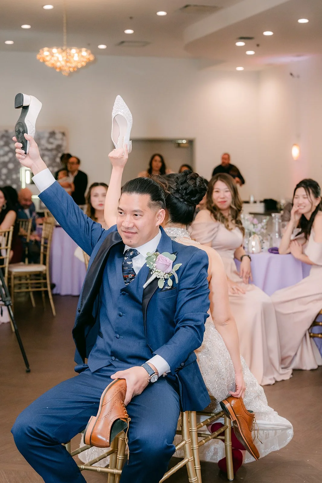 Michael holding up a shoe during the shoe game.