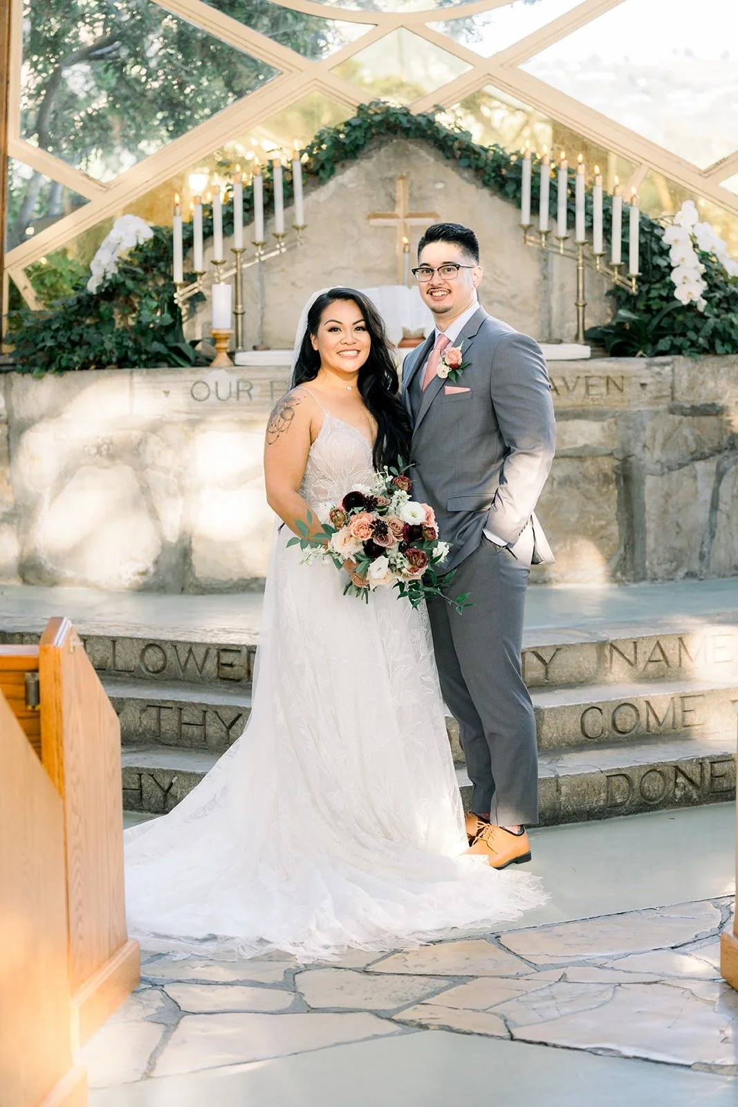 Betsy and Mikey at the altar of Wayfarers Chapel after the ceremony