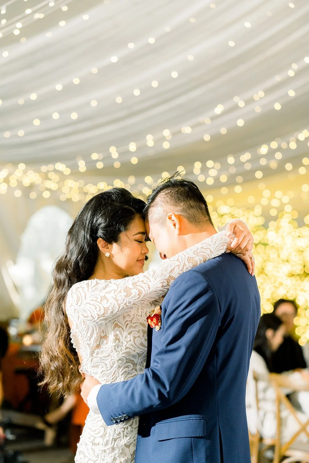 Hannah and Vincent laughing during their first dance