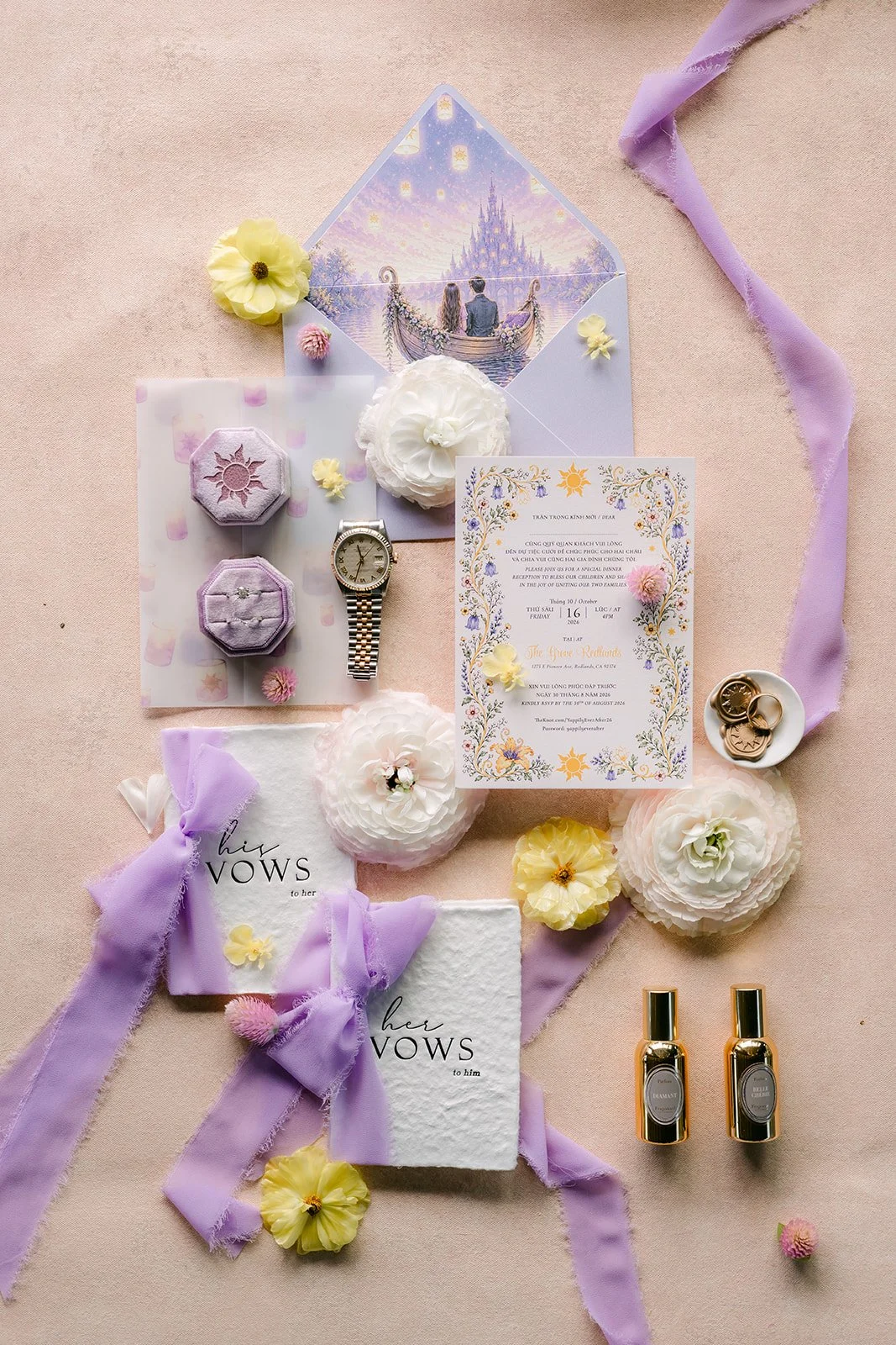 Vannie and Elijah's lilac flat lay with their invitation suite, ribbons and florals.