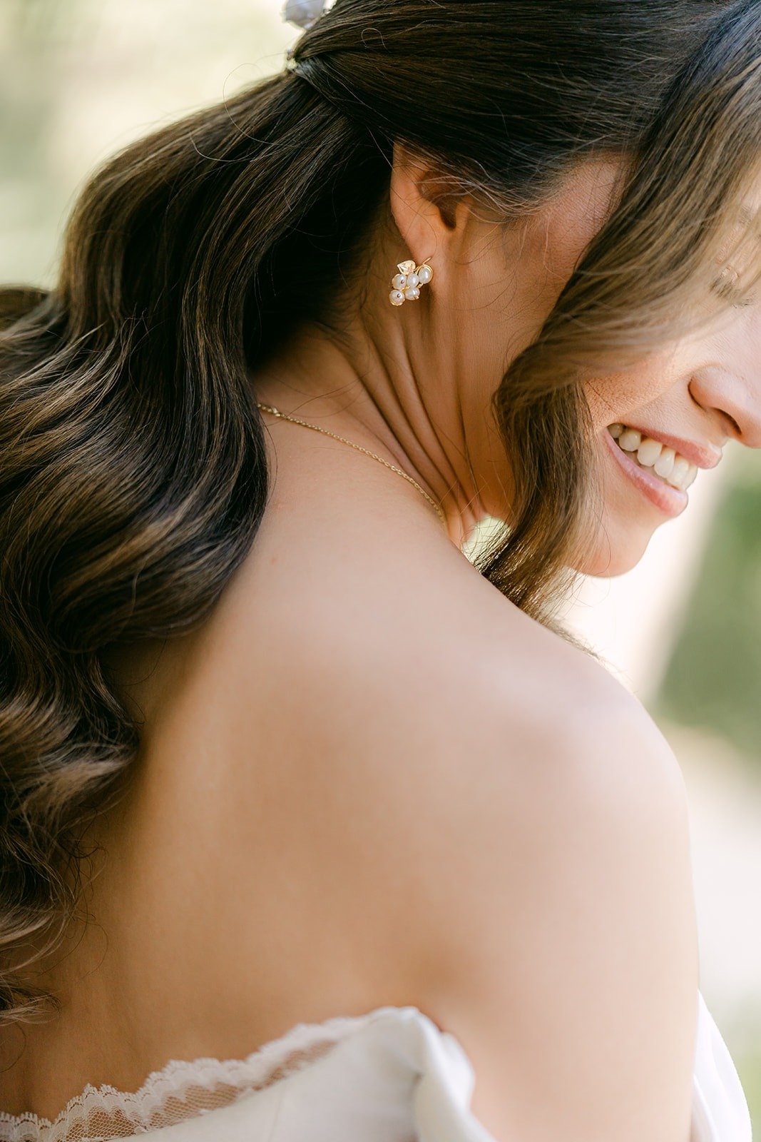 A close look at Mariana's earring and off the shoulder neckline