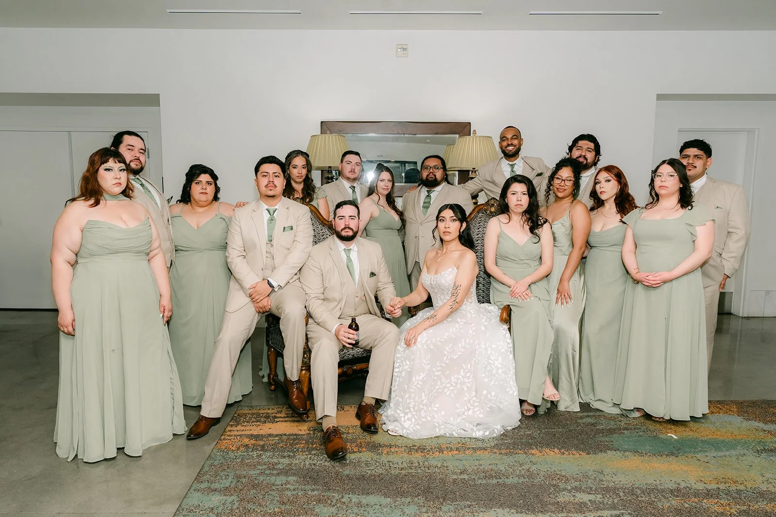 Fernanda and Cody surrounded by their wedding party, photographed by One and Only Production.