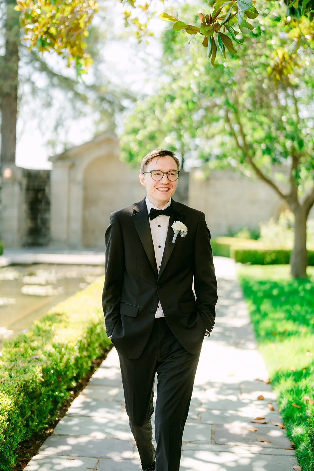 Nik walking through the Greystone Mansion gardens