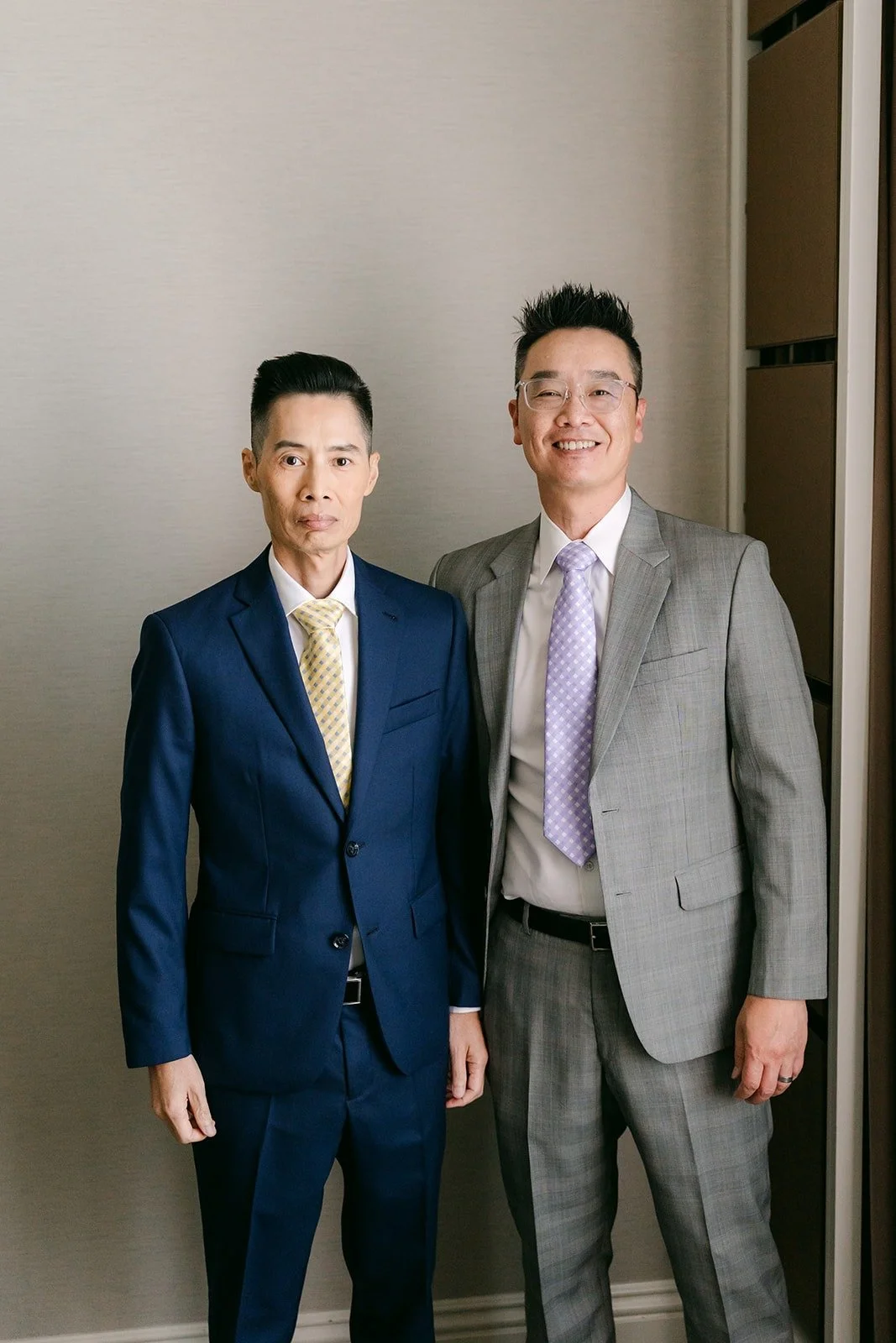 Bobby and a groomsman side by side.