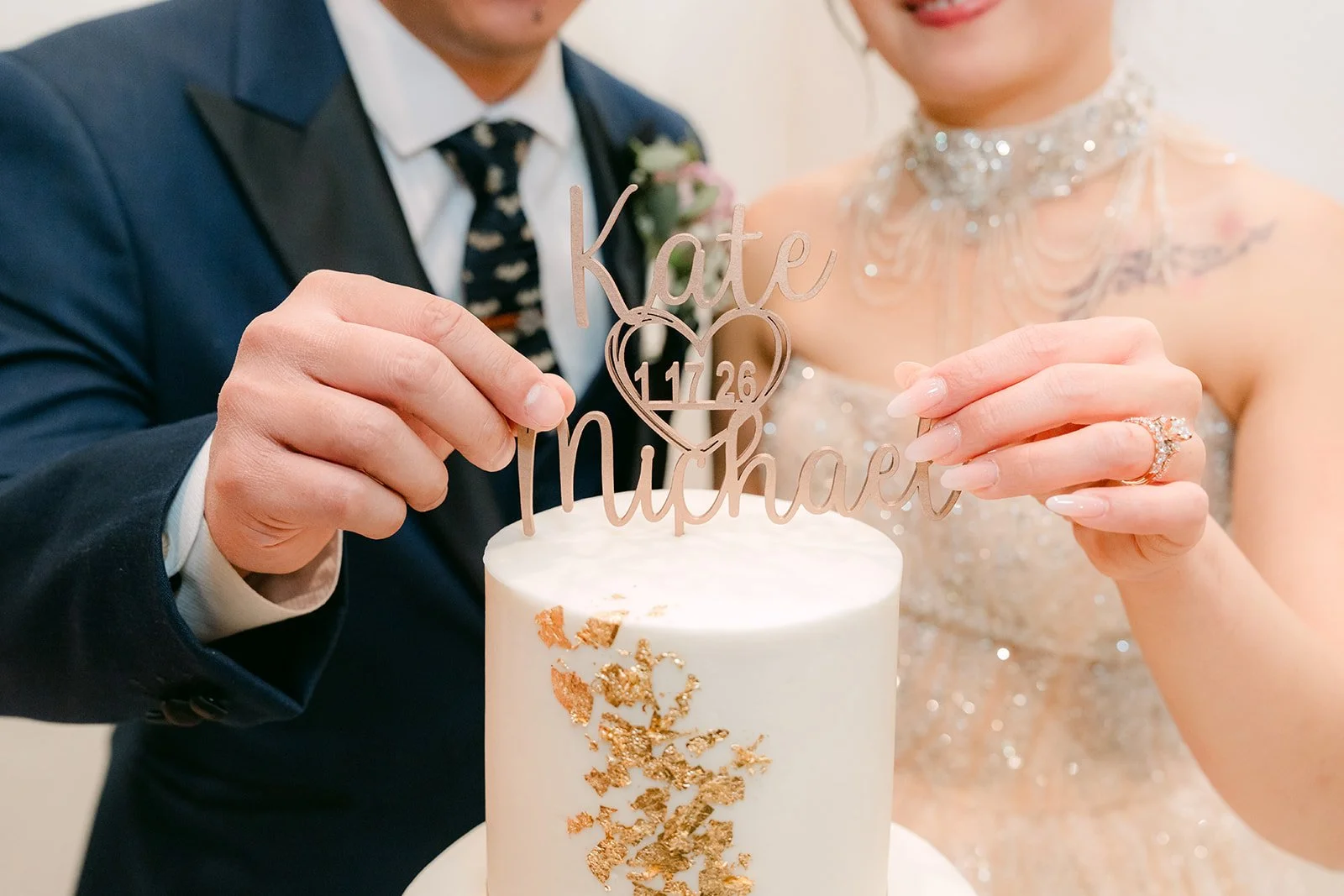 Kate and Michael cutting their wedding cake.