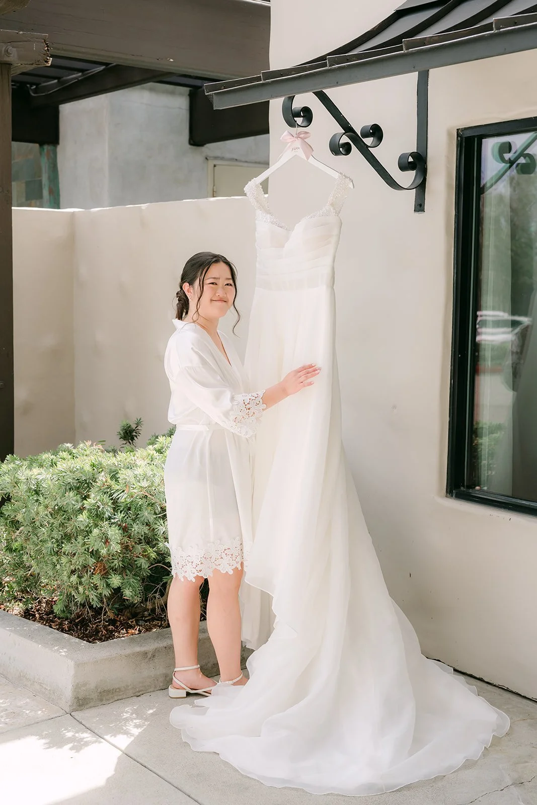 Jessica in her robe beside her gown