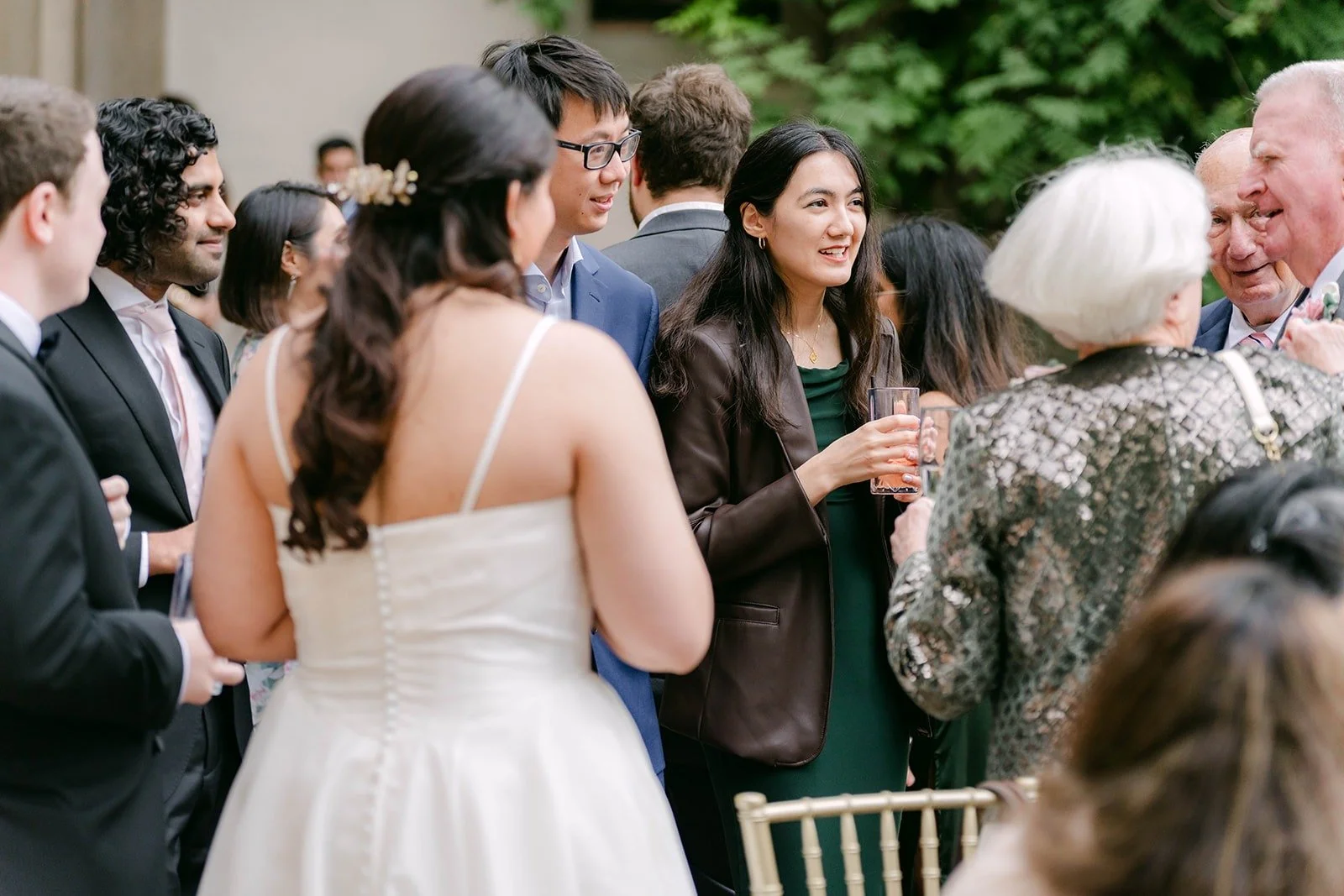 Saira sharing a laugh with friends, photographed by One and Only Production