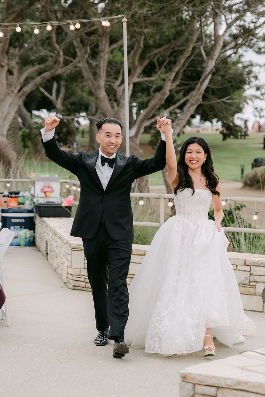Kim and Vincent's grand entrance on the reception patio
