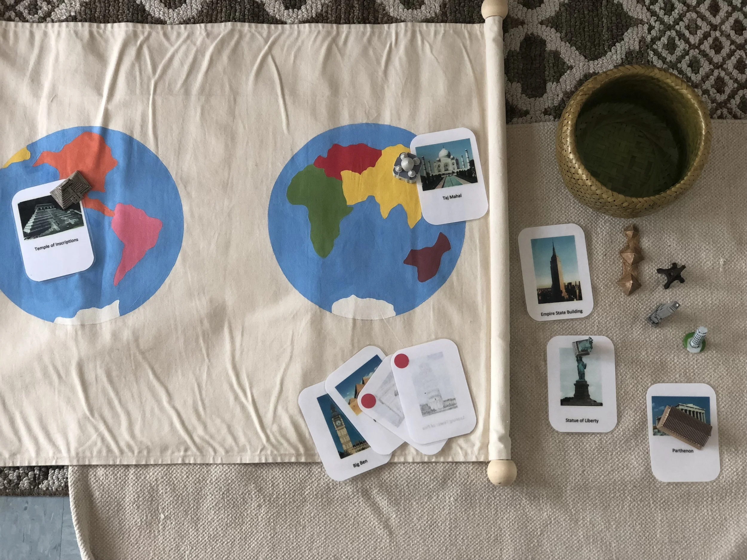  A handmade continents fabric mat with landmark cards and objects.  
