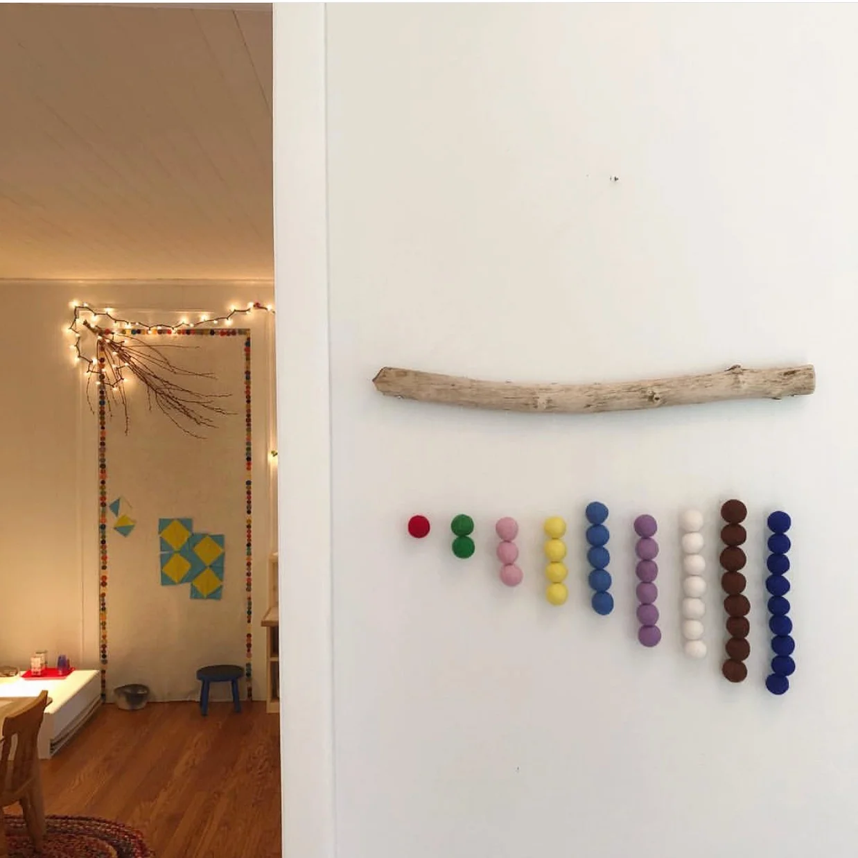  Felted wool bead stair mobile. I have made these for many people - this is a shot of it in a friend’s school.  