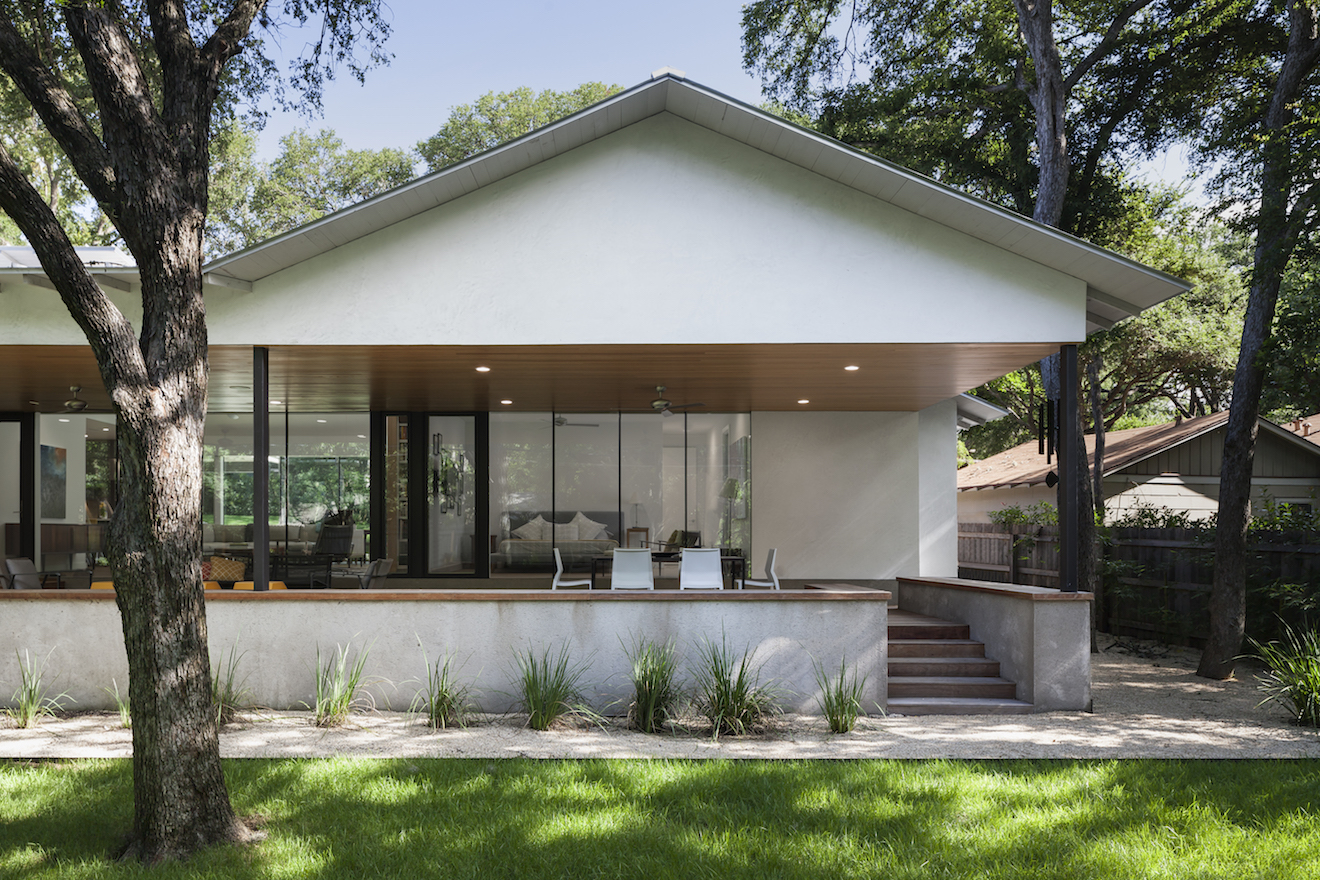 The larger dormer brings in diffused light while the smaller dormer faces the sun creating changing shafts of light. A limited material pallet of smooth white stucco, unfinished stucco, smooth white gypsum, flat vertical grain cypress and standing seam metal roof were used to create simple forms with tranquil spaces inside and out.