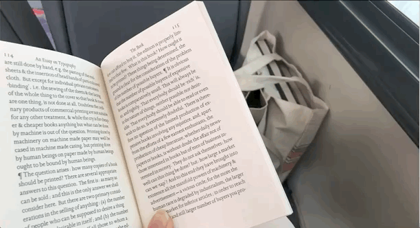 Reading in the Bus.gif