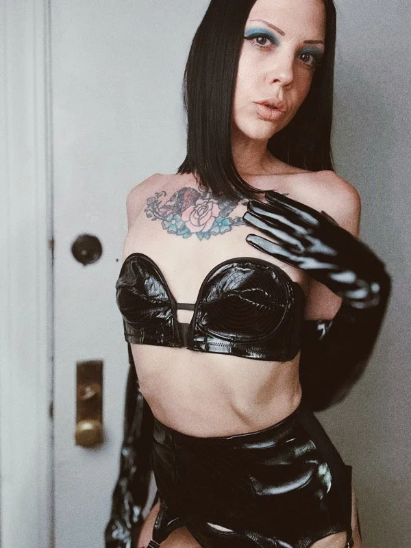 Chicago Mistress and BDSM Keyholder Maddie Royce in black vinyl and gloves