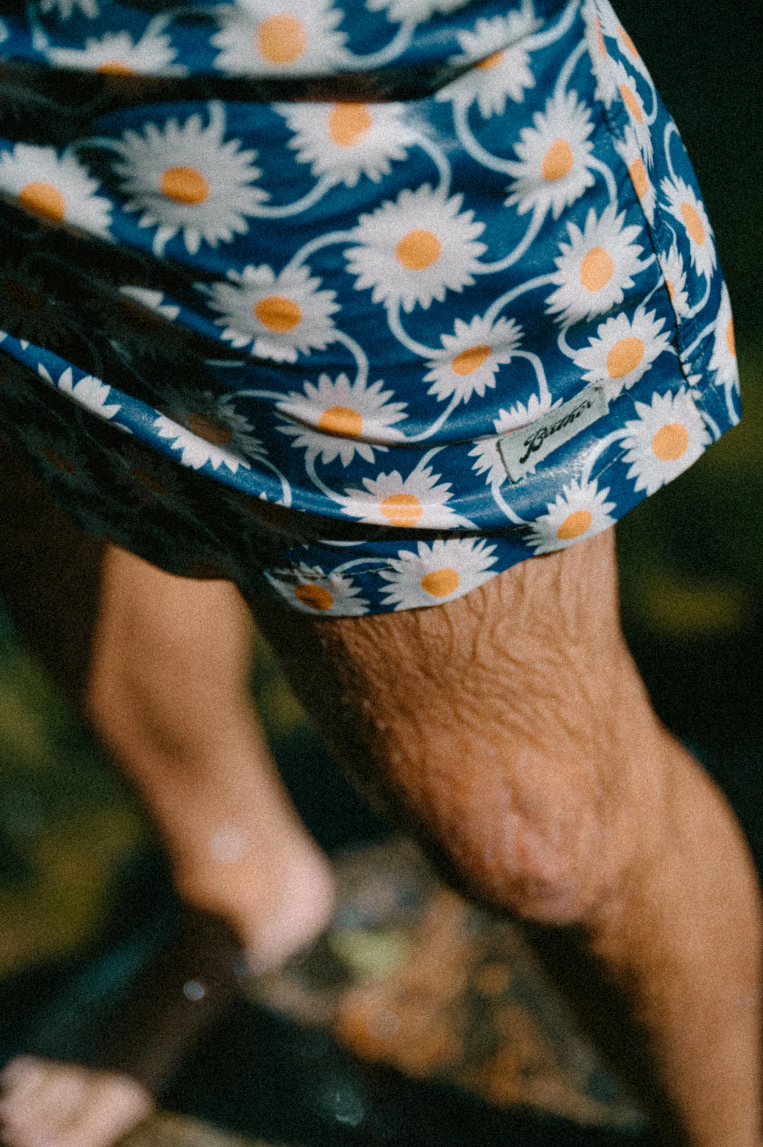 Close up detail photo of the Bather design and logo on swim trunks, shot for a lifestyle campaign
