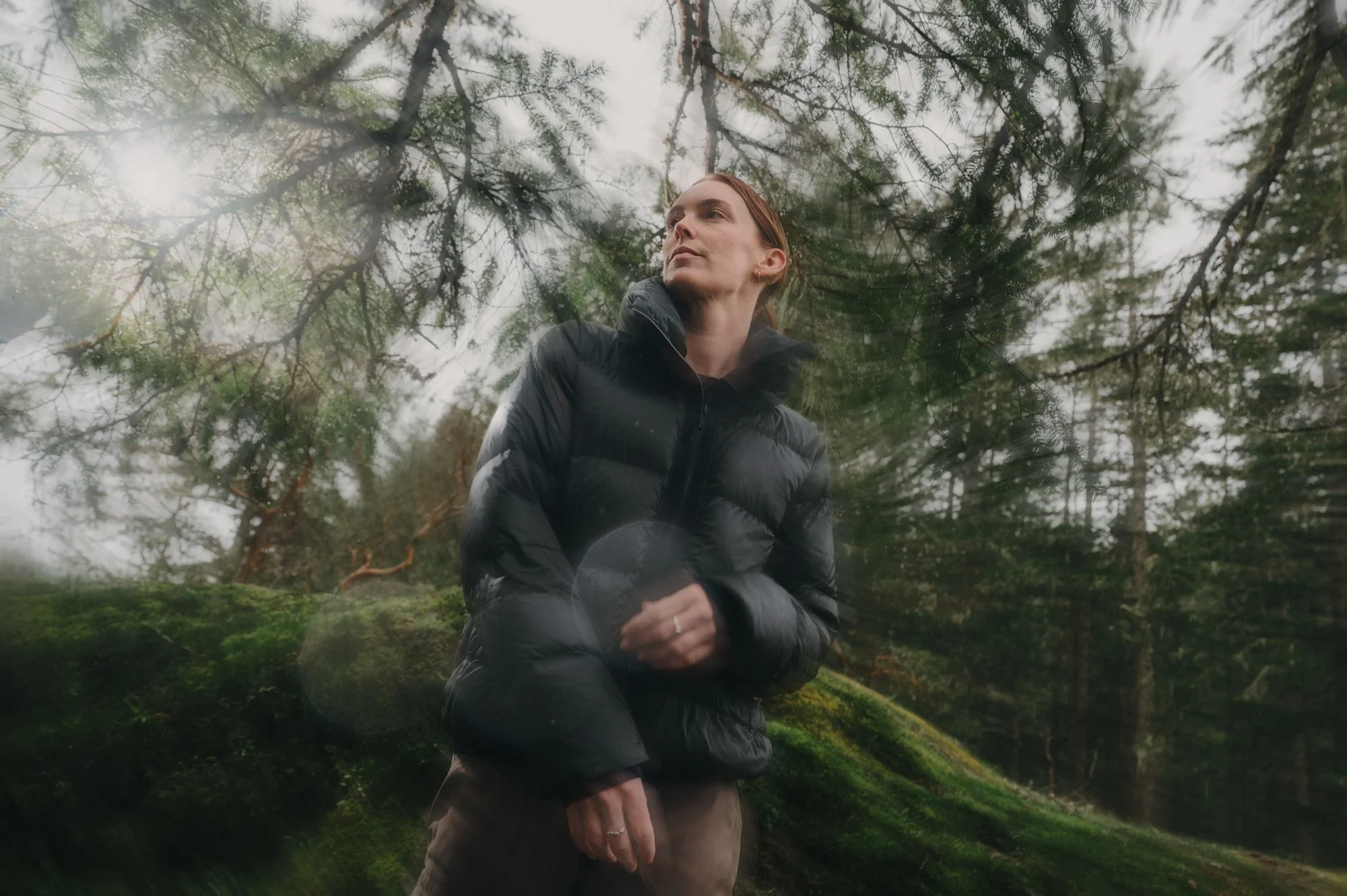 Creative editorial portrait with motion blur of a model in athleisure apparel at Thetis Lake BC, suited for an outdoor brand campaign