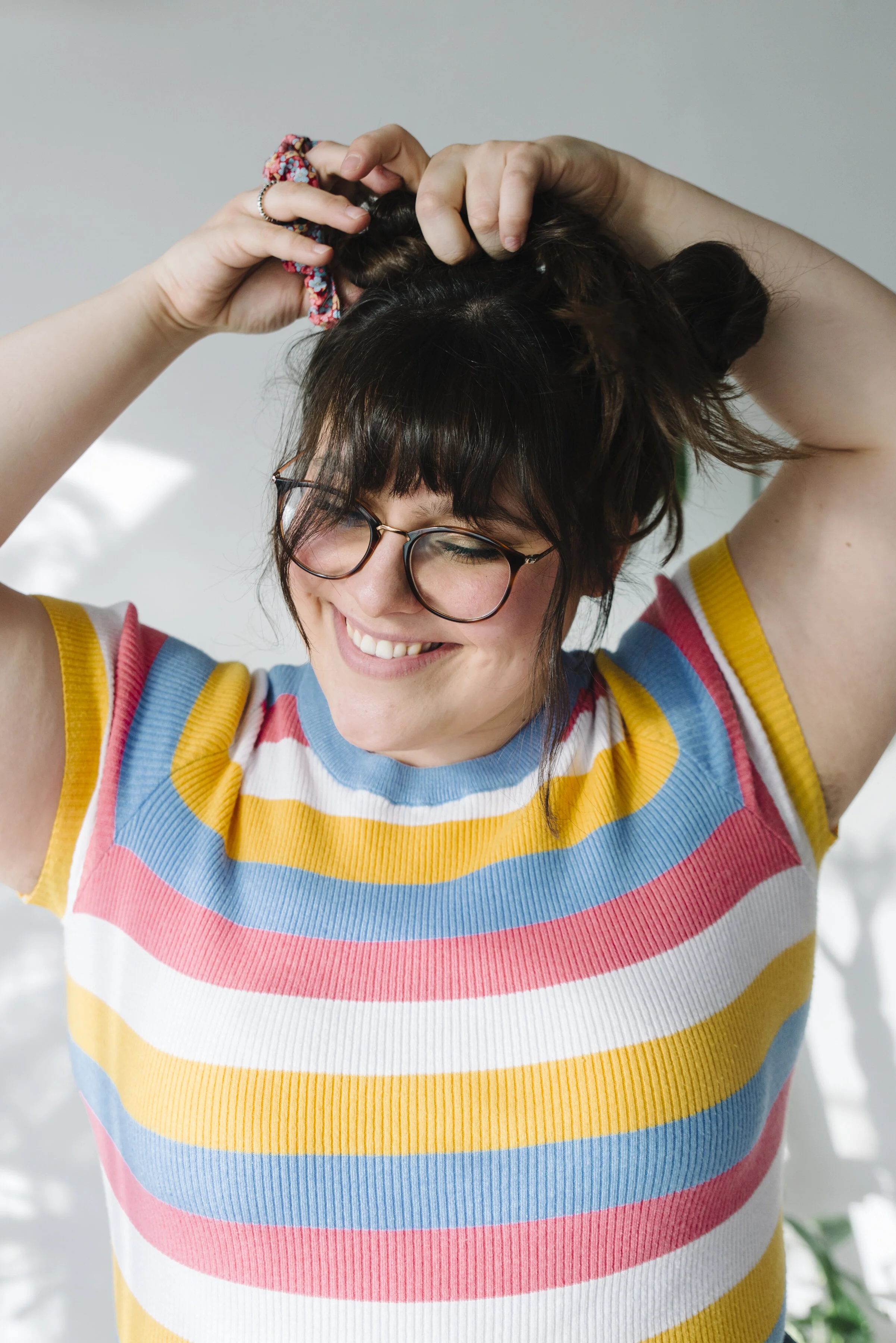 Lifestyle branding portrait of Sew Solange wearing one of her handmade scrunchies, shot for a small business personal brand photography session in Toronto