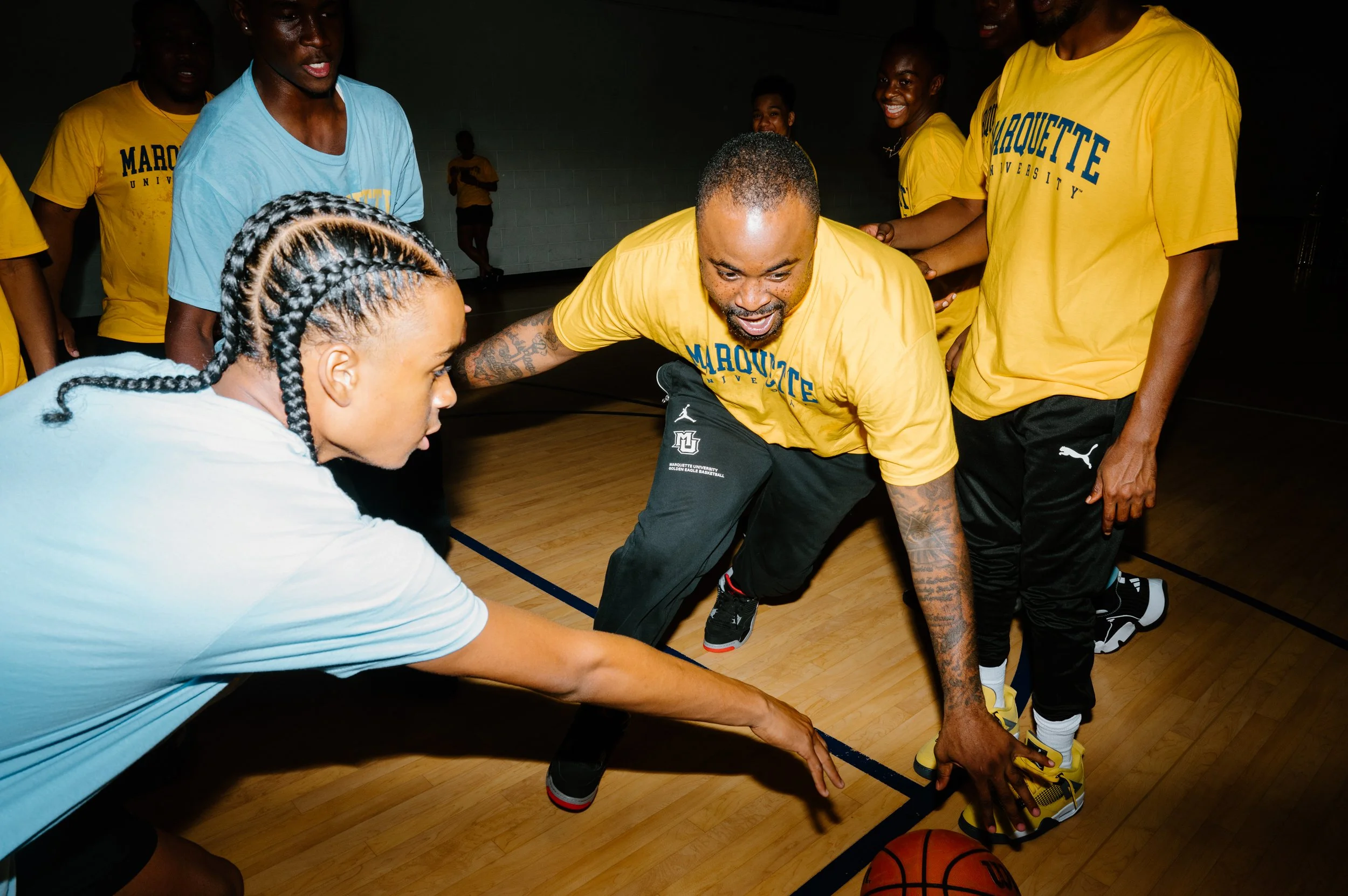Editorial action photo of Junior Cadougan in a one on one defense during Marquette basketball practice