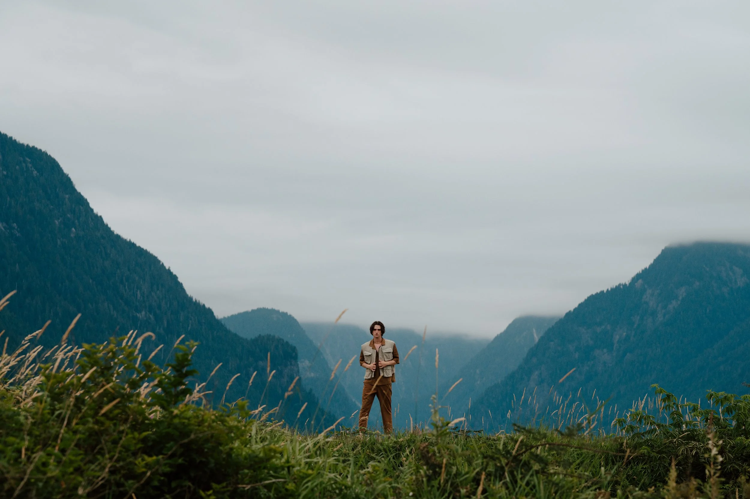 Model Callum Campbell in Pitt Meadows, BC, during a fashion test shoot with scenic mountains