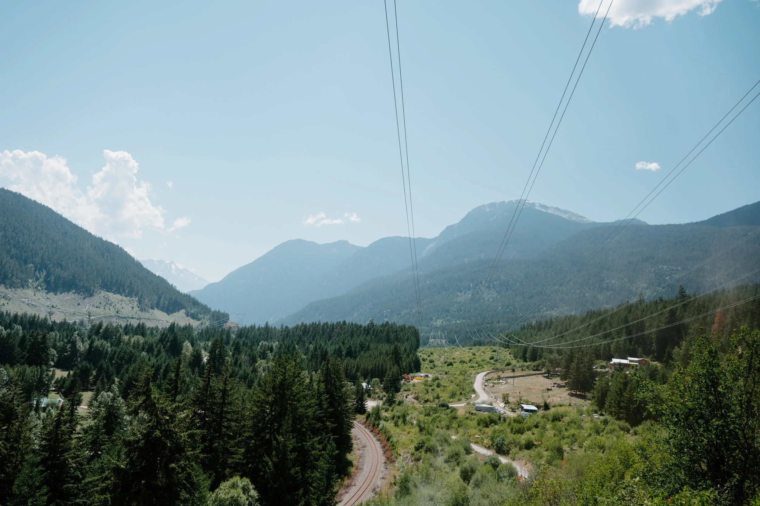 Wide landscape photo of the Pemberton BC riding area, showcasing the rugged and atmospheric terrain of the BC interior