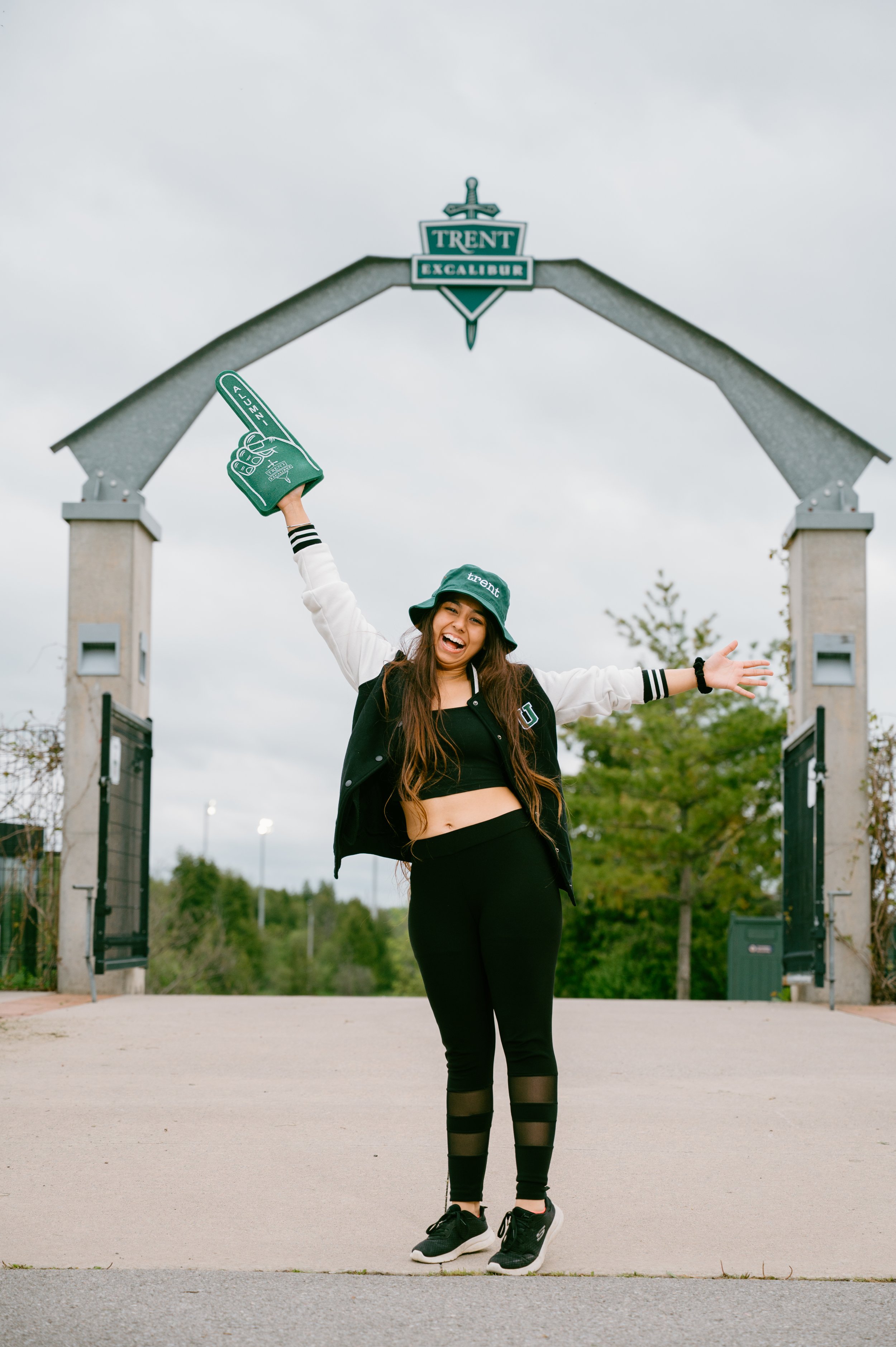 Trent University student at sports field, candid editorial photography