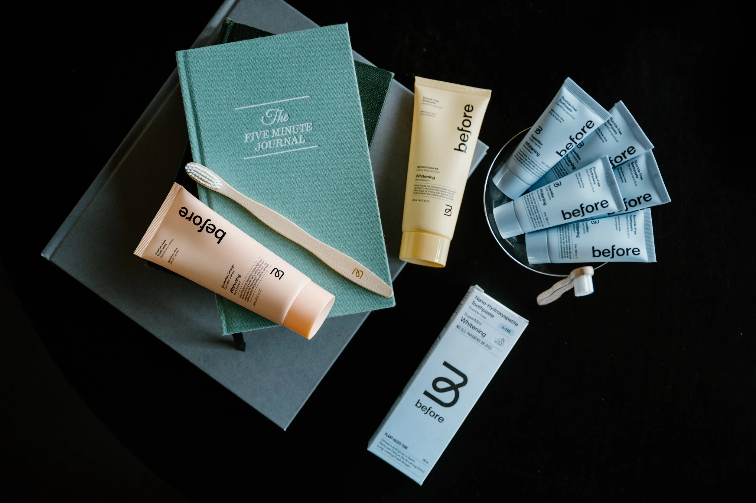 Flatlay scene featuring Before products with Five Minute Journal