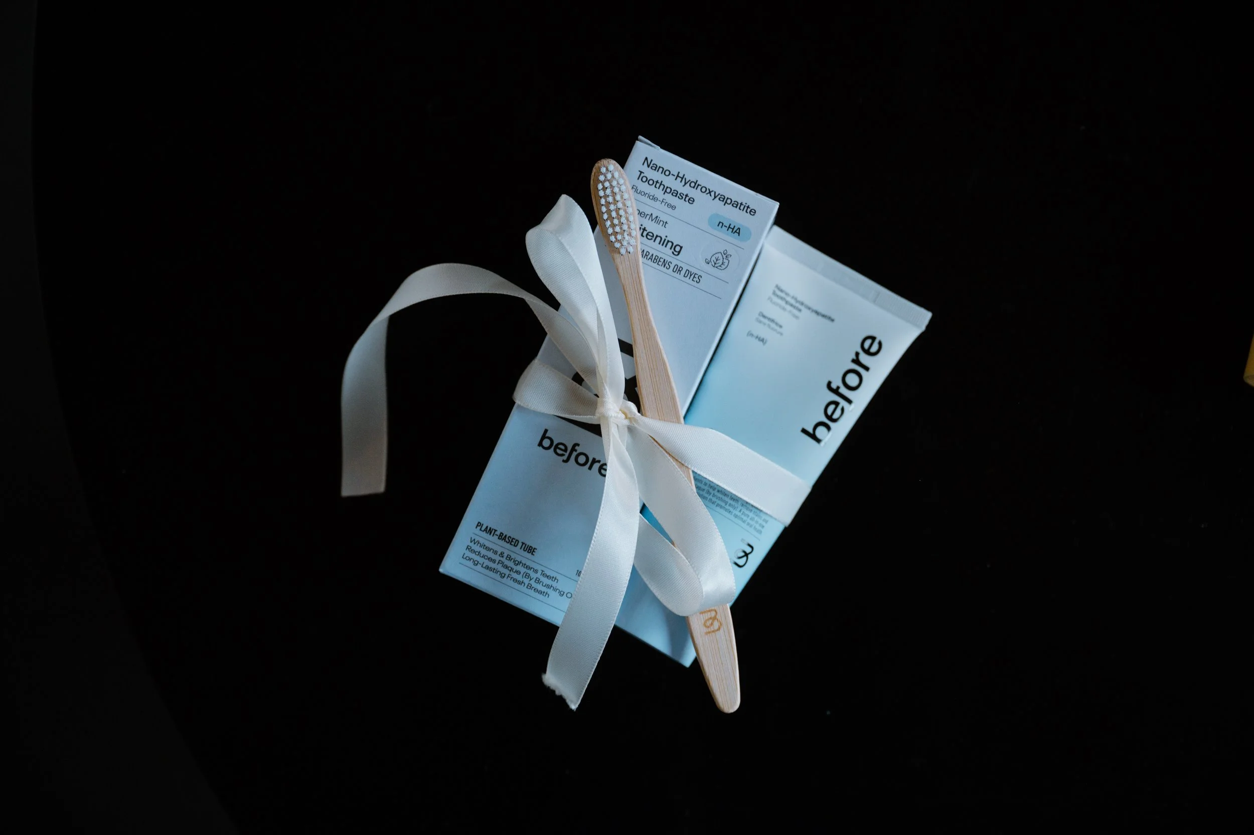 Sustainable oral care products styled as a holiday gift bundle