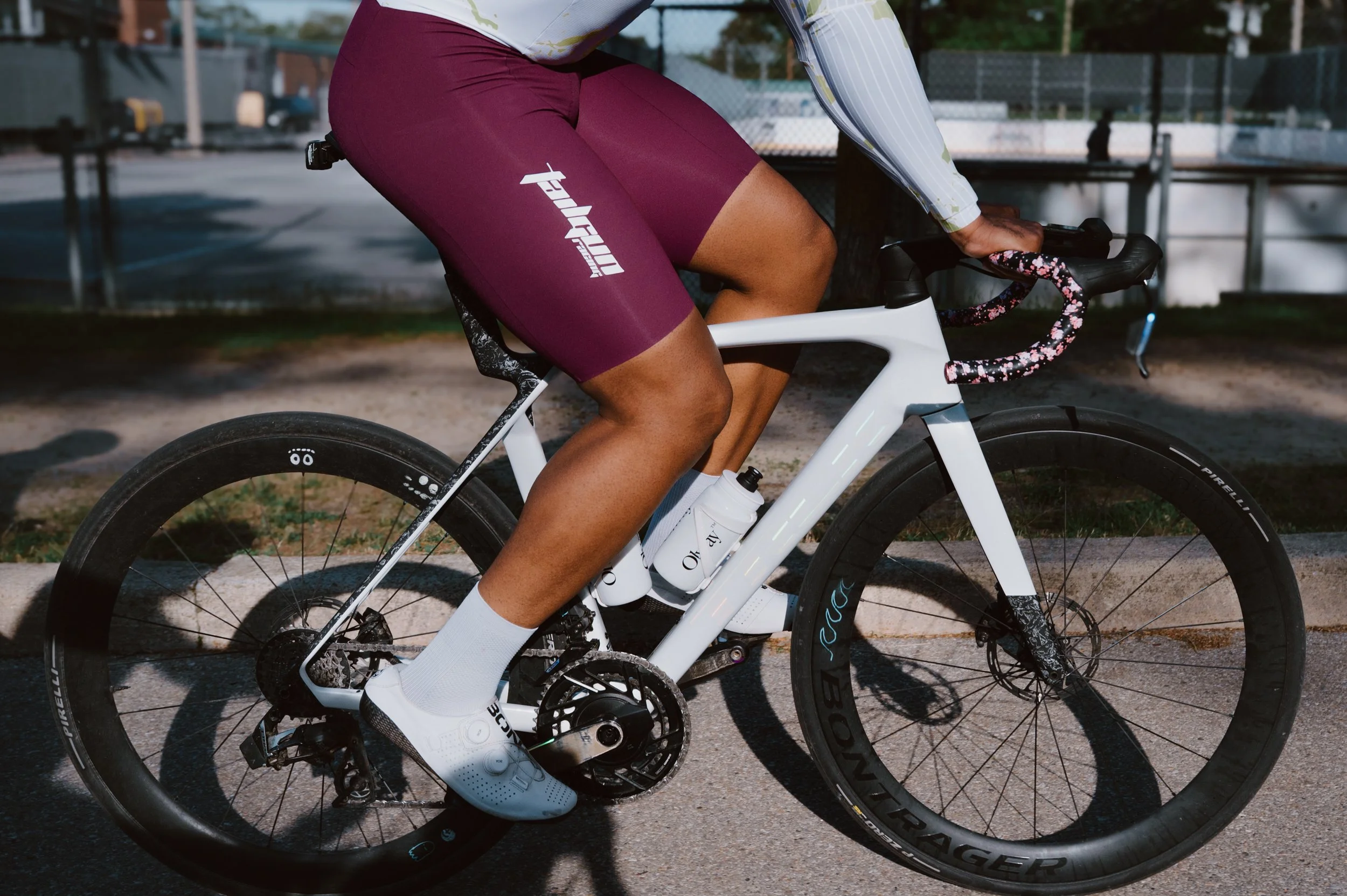 Close detail photo of a Tailgun Racing cycling bib, highlighting the team's kit branding during a ride in Toronto