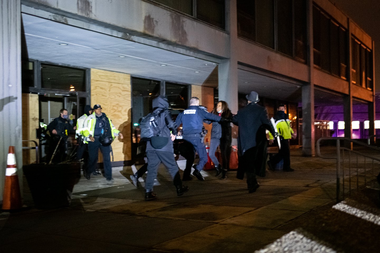  Police officers detain Karen Hylton-Brown, the mother of Karon Hylton-Brown, outside of the MPD Fourth District Headquarters, in Washington, D.C., on December 19, 2020. MPD released her later in the night, but did not provide a reason for the hours-