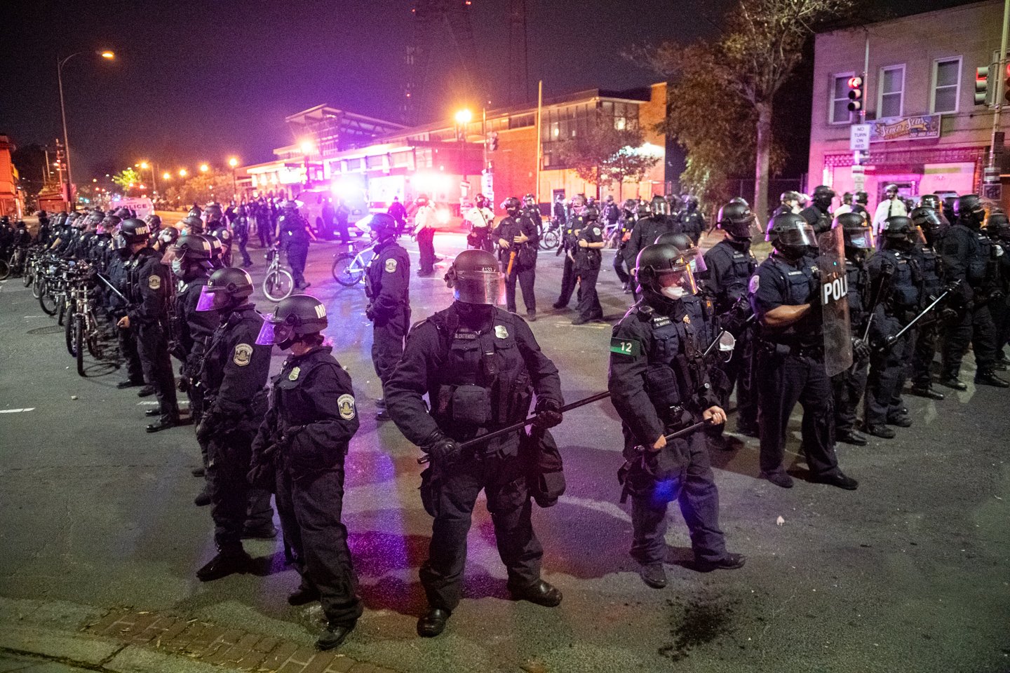  Crowds of riot police standing in formation create a security perimeter near the MPD Fourth District Headquarters after forcefully clearing the area of protesters, in Washington, D.C., on October 27, 2020. (Photo by Graeme Sloan) 