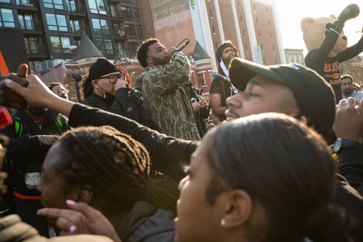  MC Justin “Yaddiya” Johnson, center, performs with local GoGo artists during a Moechella street concert and protest against proposed restrictions on amplified noise, in Washington, D.C., on March 14, 2021. (Photo by Graeme Sloan) 